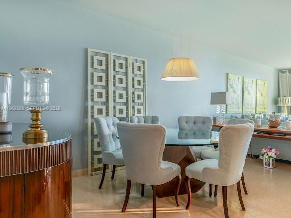 450 Alton Road, Unit 1202 Miami Beach, FL 33139 - Photo 58 of 68 a view of a dining room with furniture and wooden floor