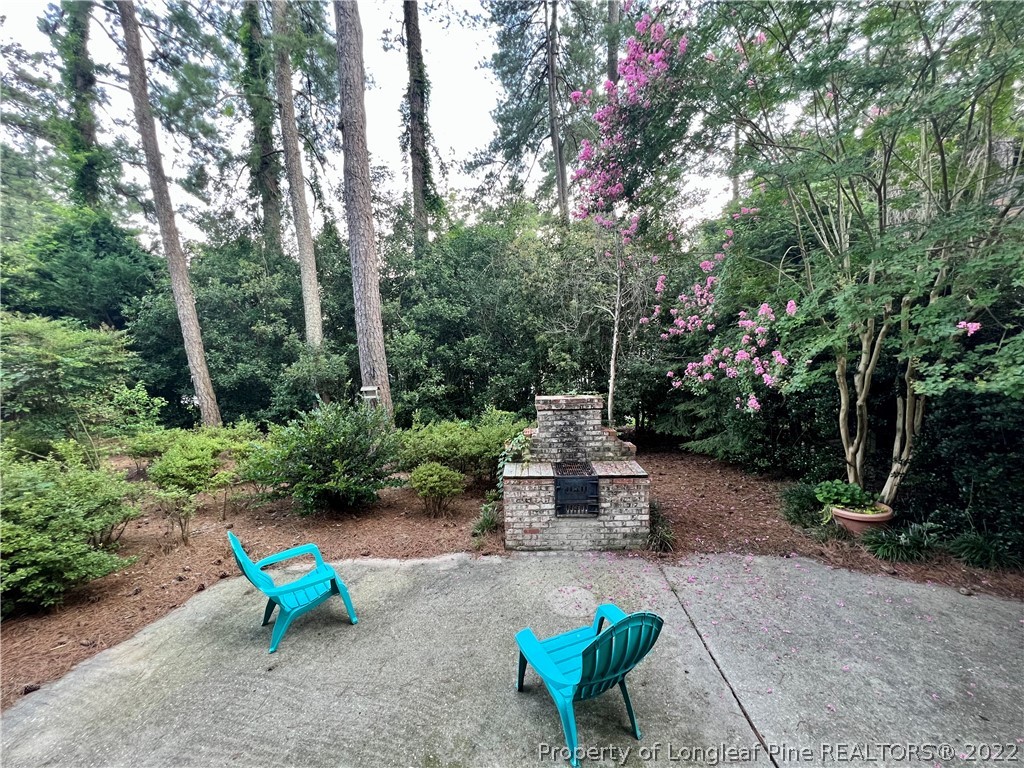 2823 Millbrook Road Fayetteville, NC 28303 - Photo 18 of 20 a view of a bench in a garden