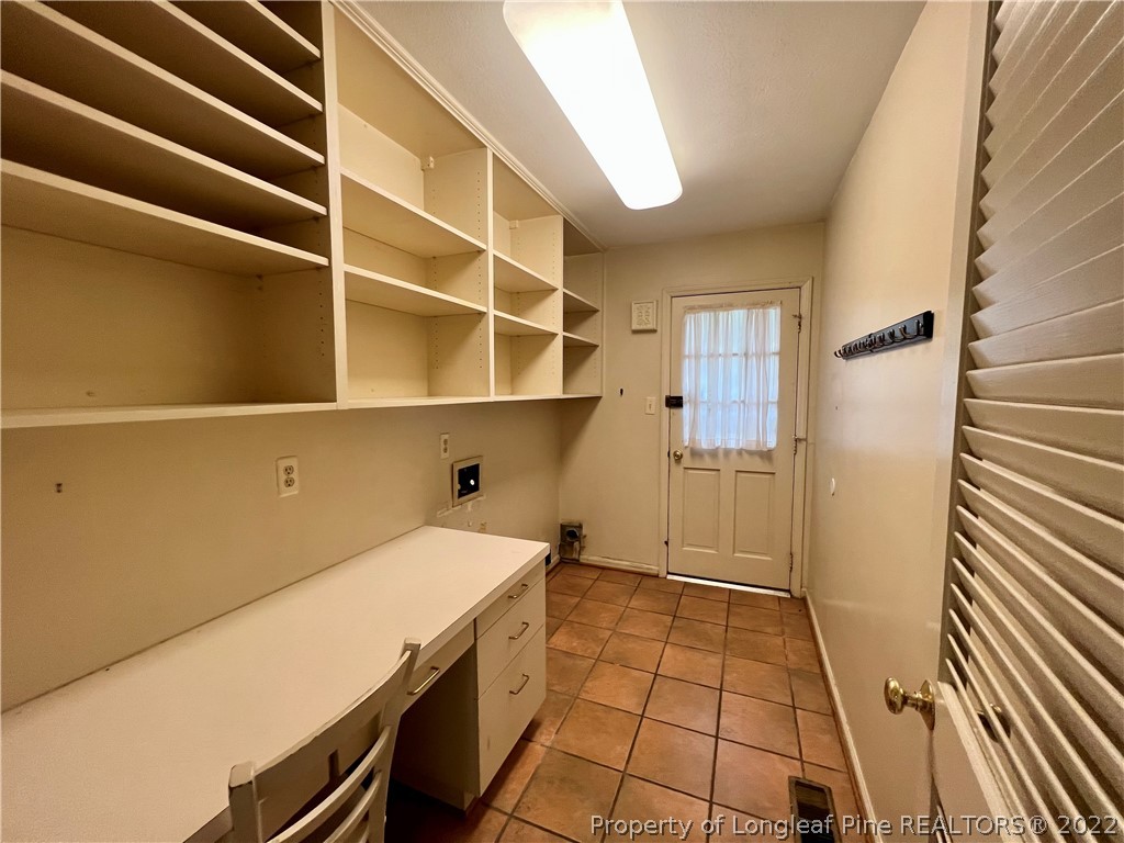 2823 Millbrook Road Fayetteville, NC 28303 - Photo 8 of 20 a room with storage and utility