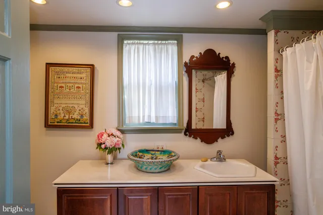 a bathroom with a sink and a mirror