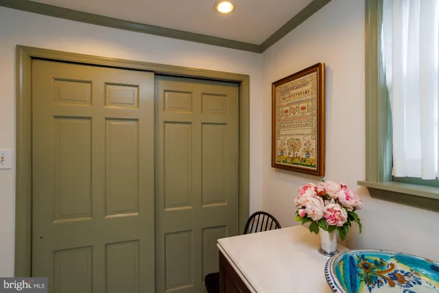 a bathroom with a sink mirror and a shower