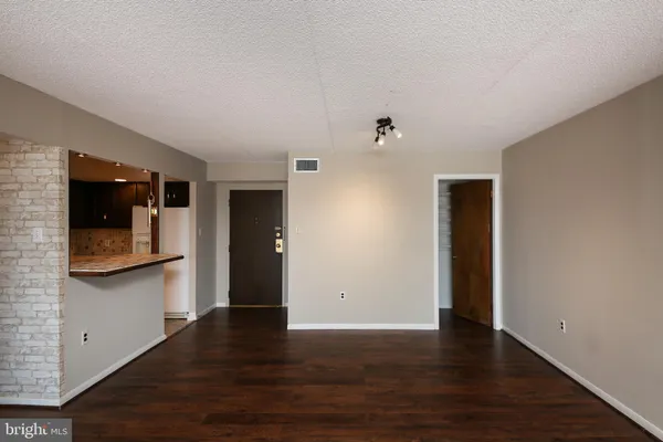 a view of a kitchen with a sink and a microwave