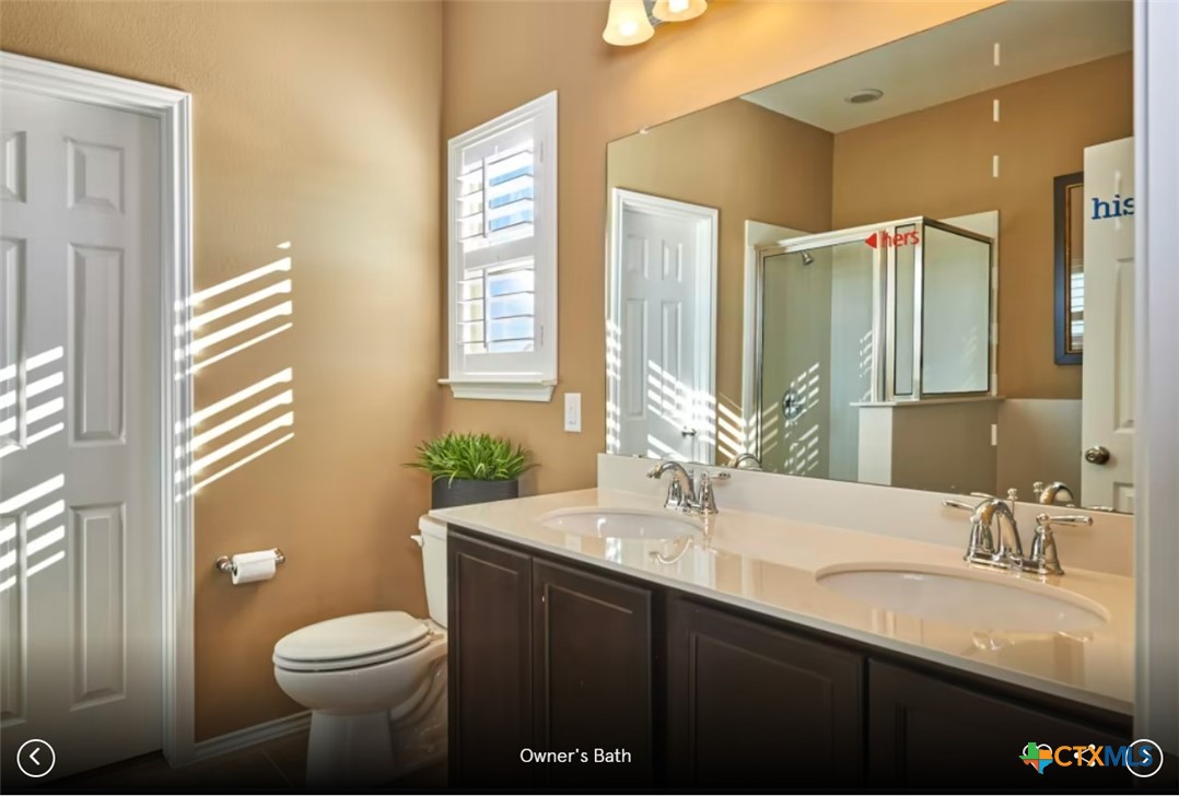 2805 McKinney Court Temple, TX 76501 - Photo 6 of 6 a bathroom with a double vanity sink toilet and a mirror