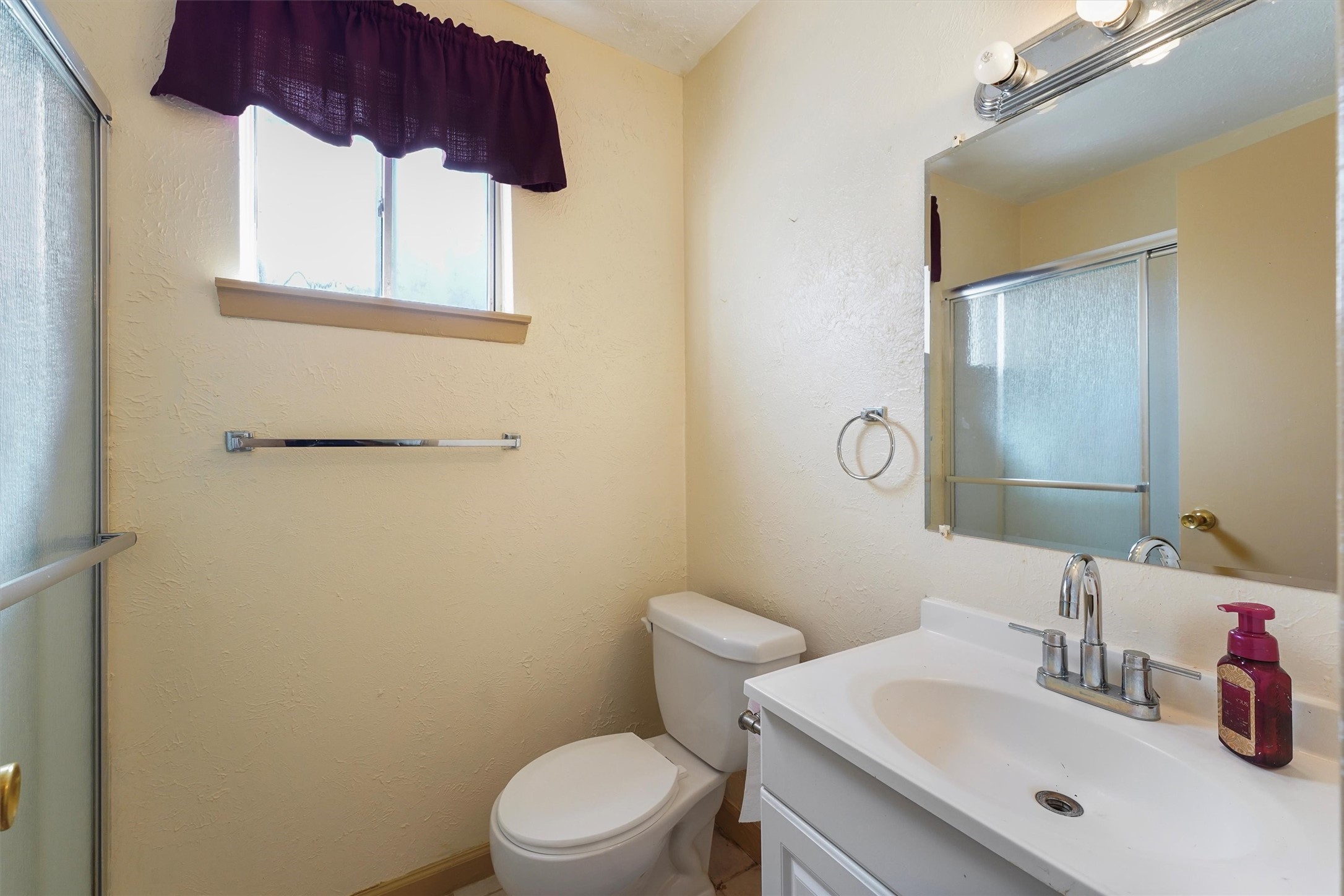 730 Stonyridge Street Channelview, TX 77530 - Photo 21 of 26 a bathroom with a sink a toilet and mirror