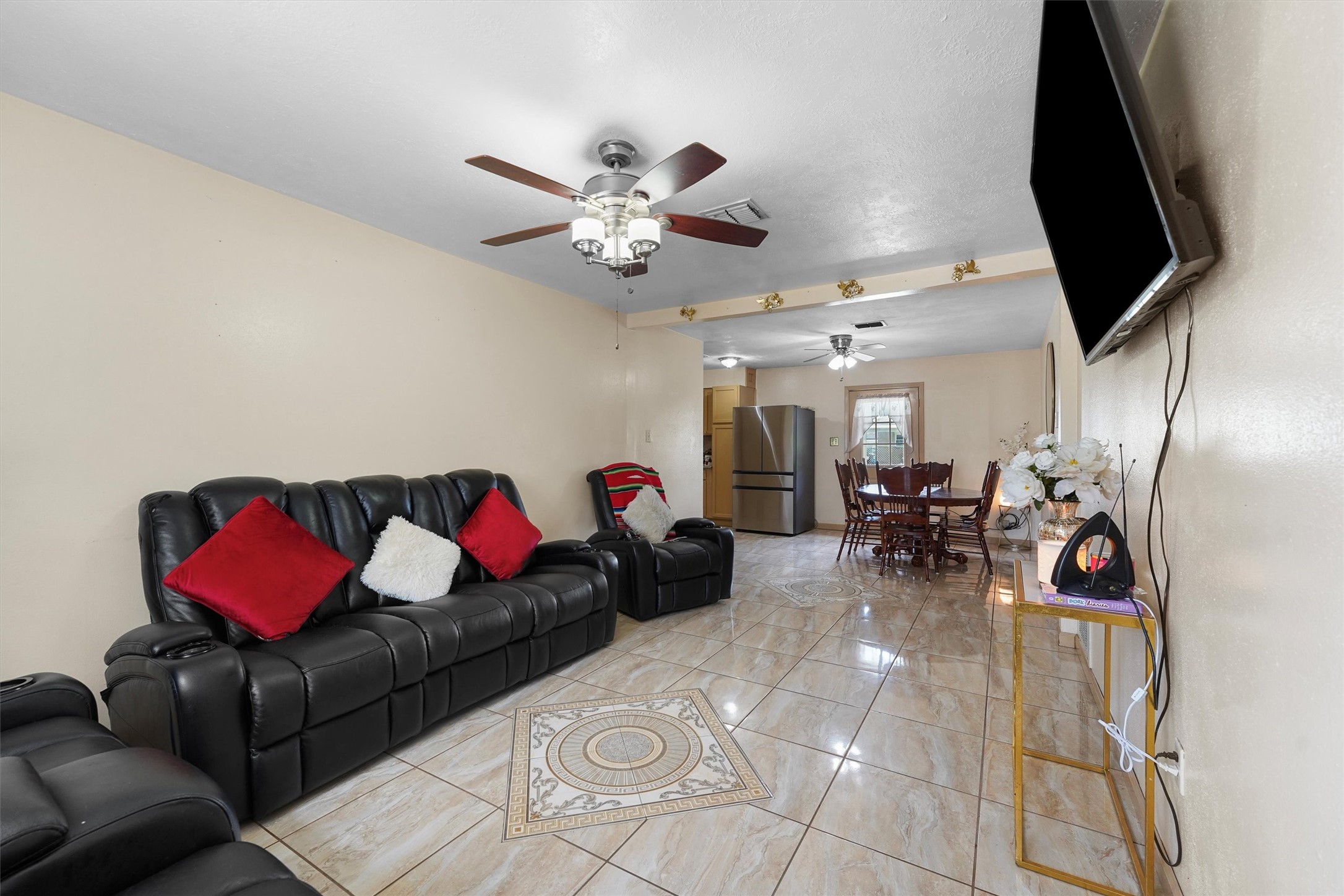 730 Stonyridge Street Channelview, TX 77530 - Photo 5 of 26 a living room with furniture a rug and a flat screen tv