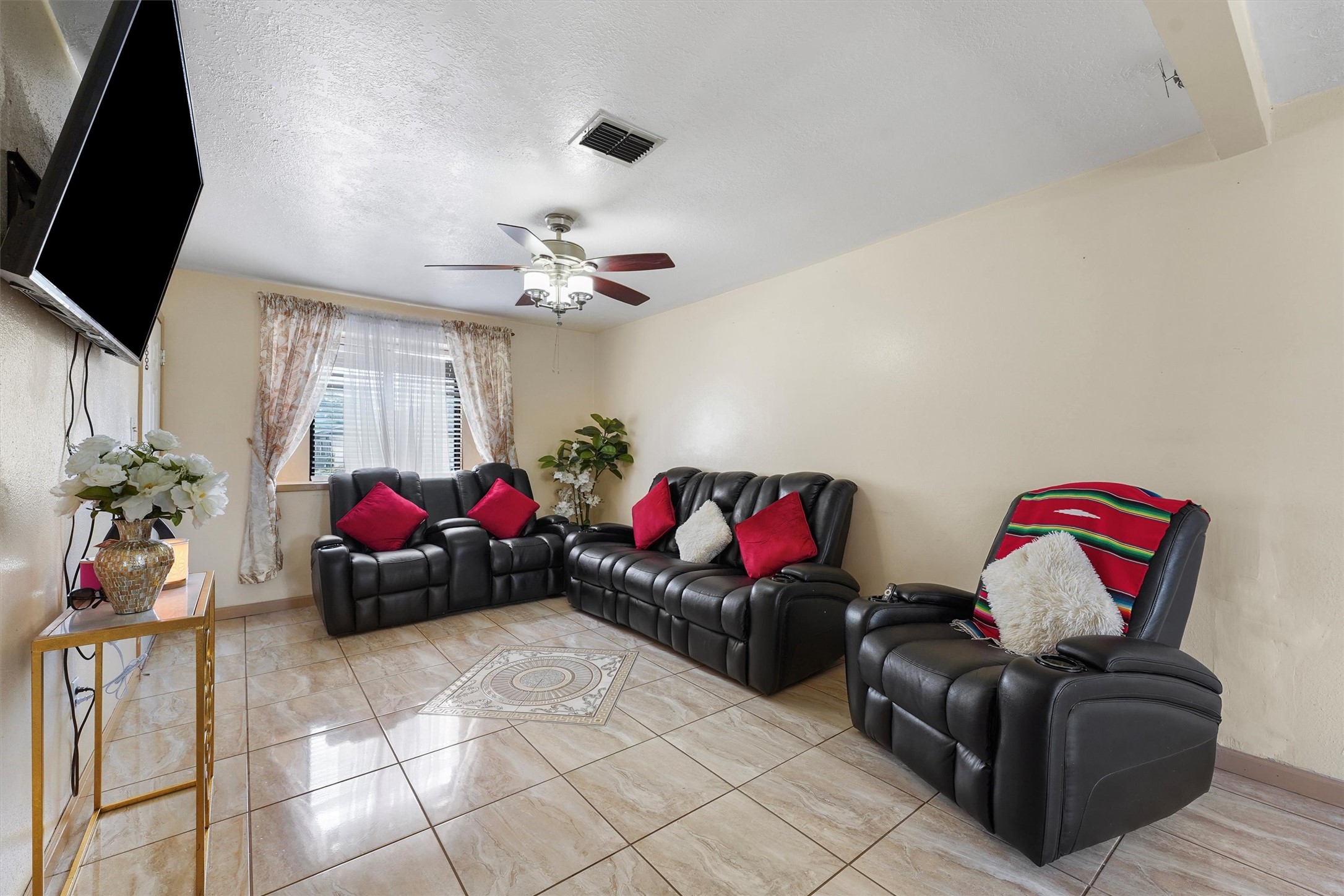 730 Stonyridge Street Channelview, TX 77530 - Photo 7 of 26 a living room with furniture and a flat screen tv