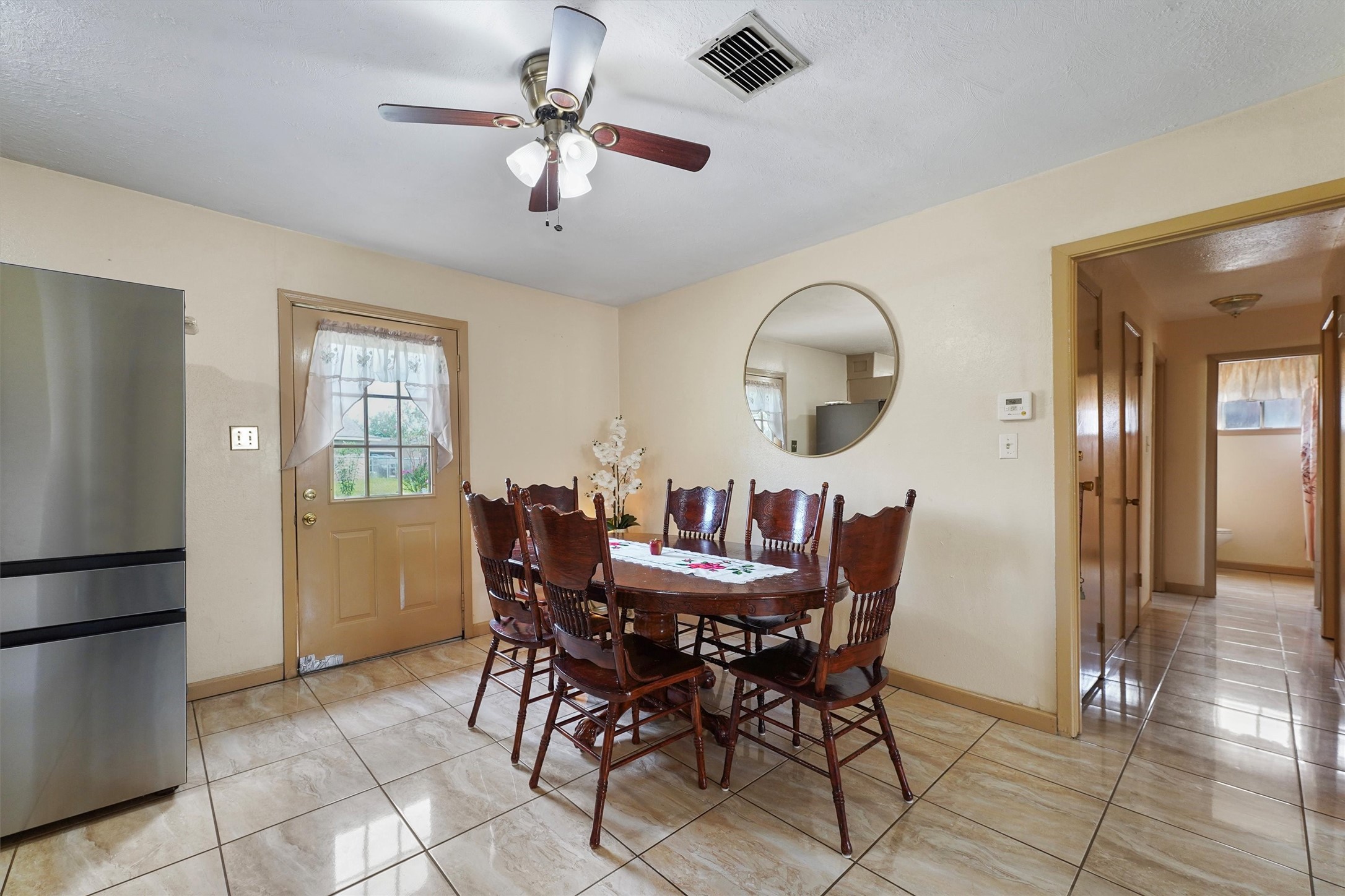 730 Stonyridge Street Channelview, TX 77530 - Photo 9 of 26 a view of a dining room with furniture and chandelier