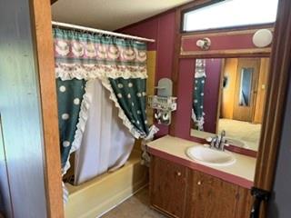 45 Grant Street Fredonia, PA 16124 - Photo 11 of 22 a bathroom with a sink a mirror and shower