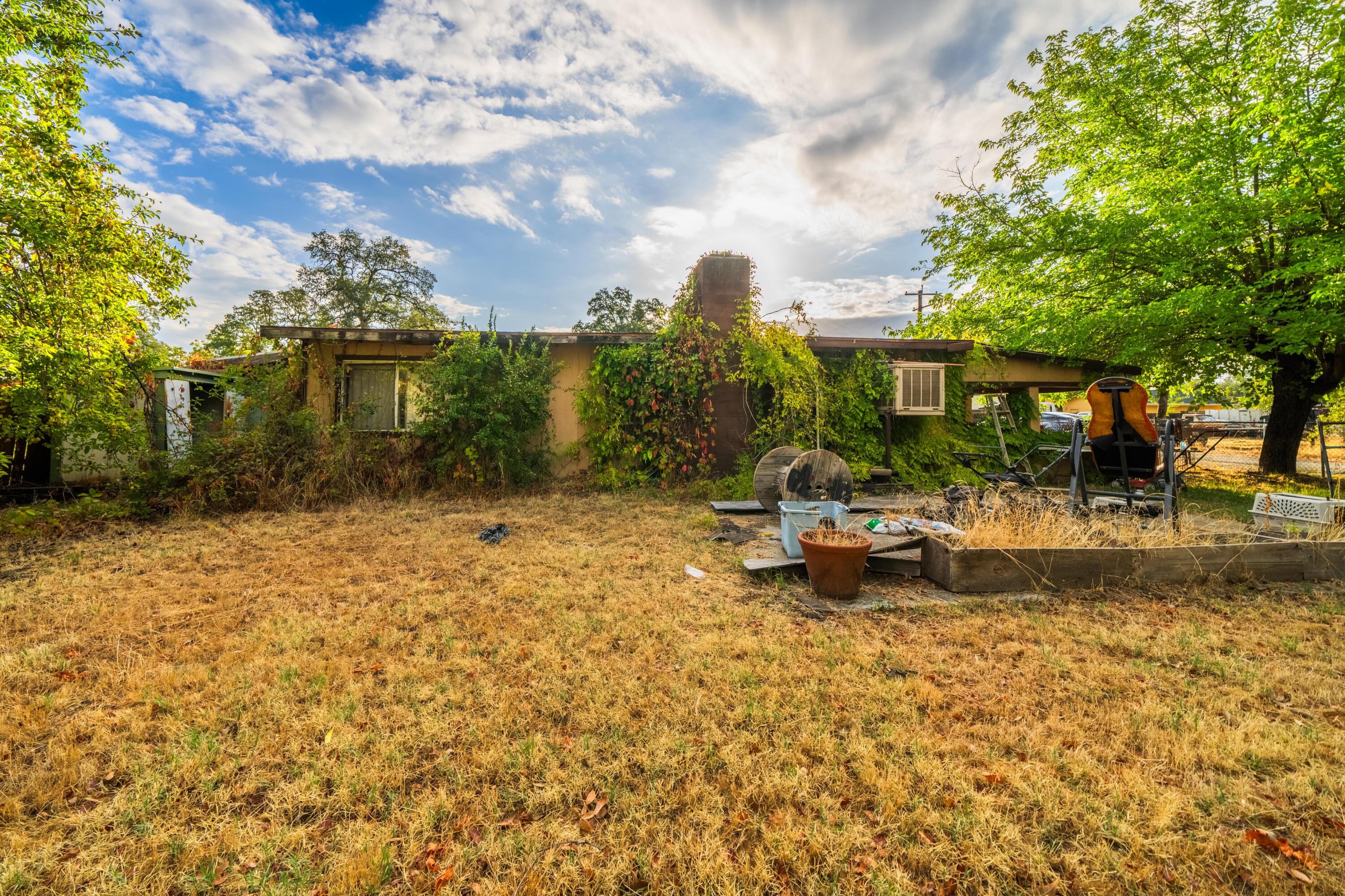 18534 Candy Lane Redding, CA 96003 - Photo 13 of 20 a view of a fountain in front of house
