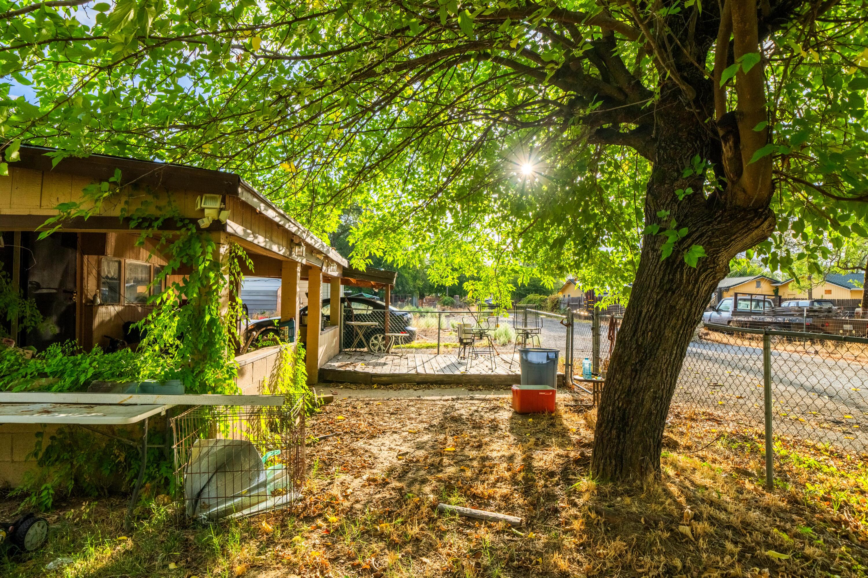 18534 Candy Lane Redding, CA 96003 - Photo 18 of 20 a view of a house with large trees
