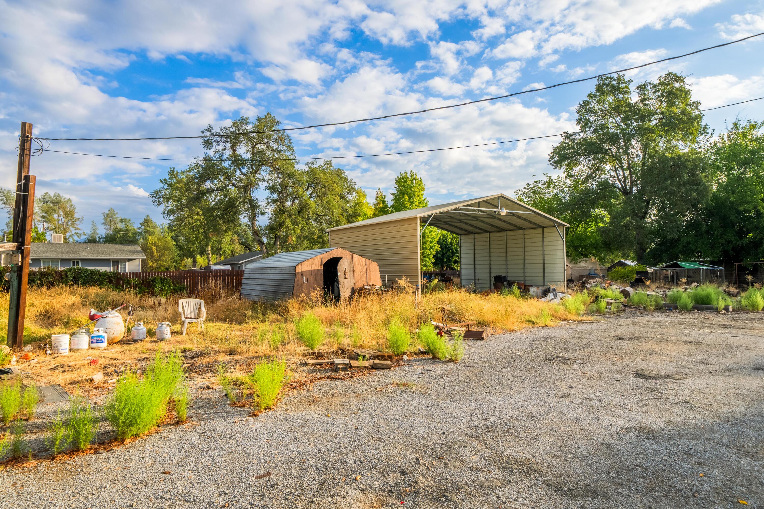 18534 Candy Lane Redding, CA 96003 - Photo 19 of 20 a view of a house with backyard outdoor seating area and swimming pool