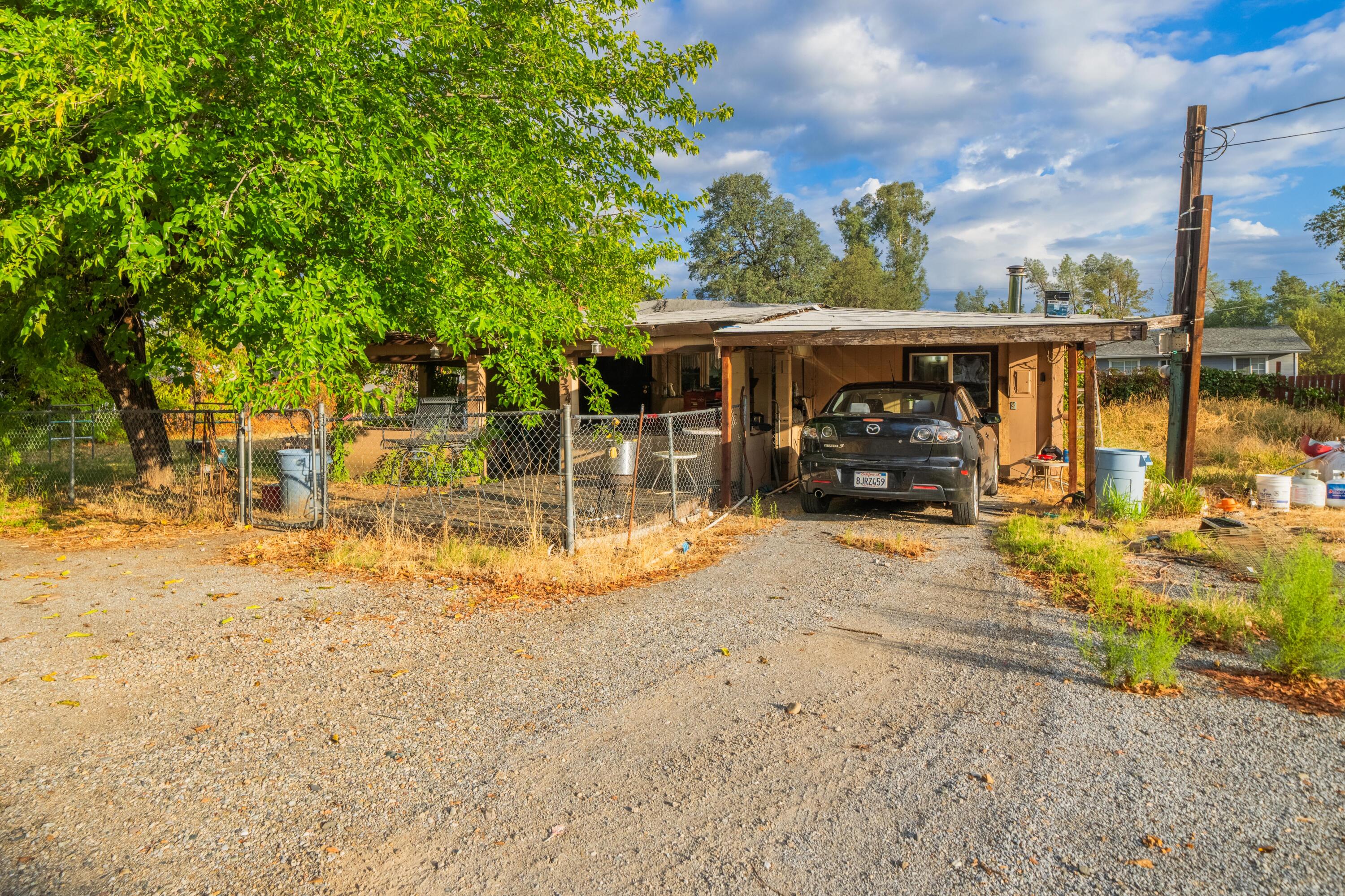 18534 Candy Lane Redding, CA 96003 - Photo 2 of 20 a view of a house with backyard porch and sitting area
