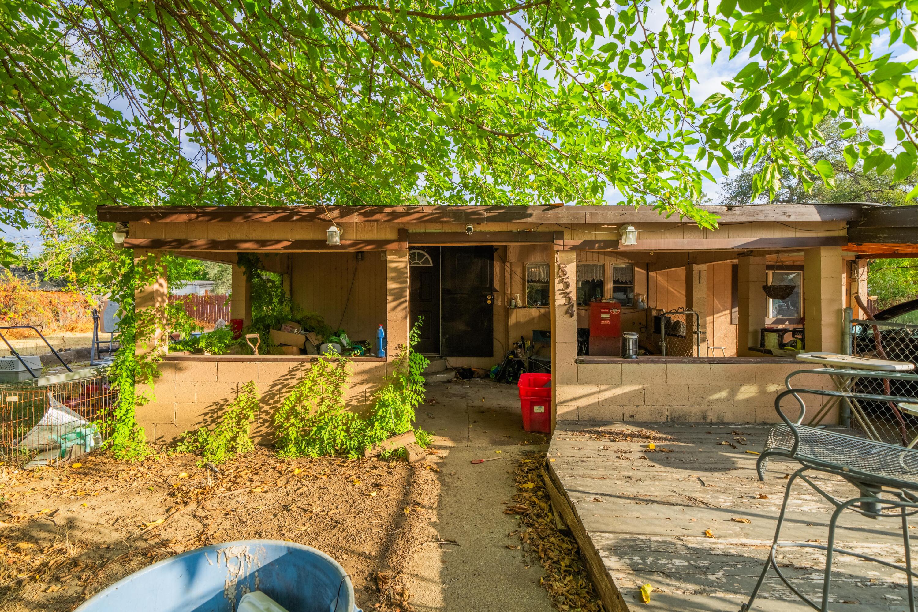 18534 Candy Lane Redding, CA 96003 - Photo 3 of 20 a view of a house with sitting area and garden