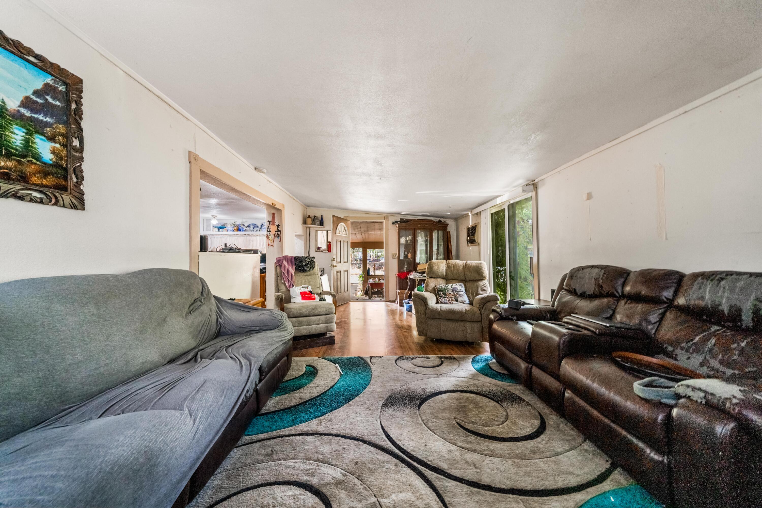 18534 Candy Lane Redding, CA 96003 - Photo 7 of 20 a living room with furniture and a large window
