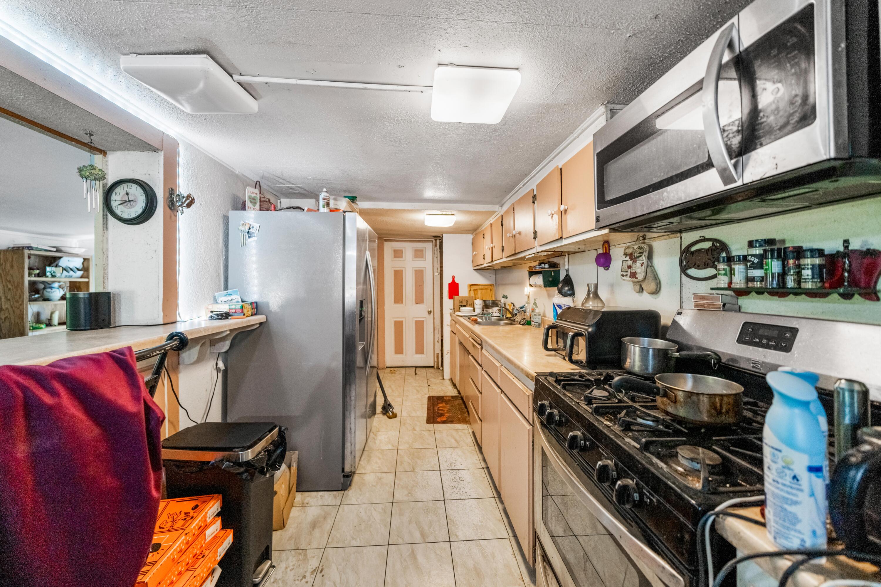 18534 Candy Lane Redding, CA 96003 - Photo 8 of 20 a kitchen with stainless steel appliances granite countertop a stove and a refrigerator