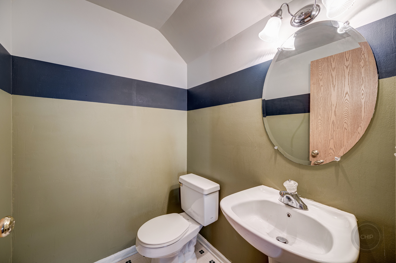752 County Line Road Aurora, IL 60502 - Photo 17 of 30 a bathroom with a toilet sink and mirror
