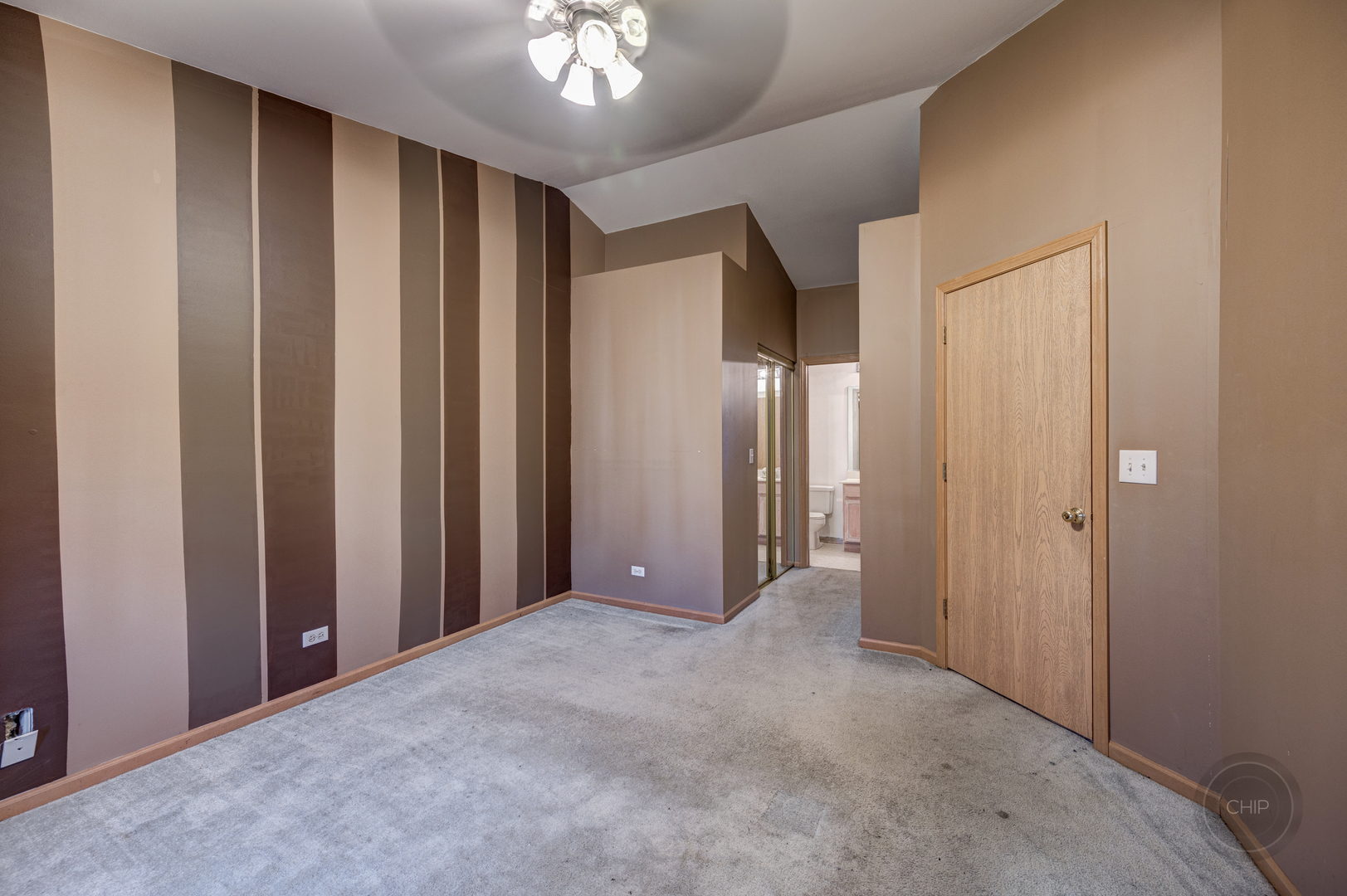 752 County Line Road Aurora, IL 60502 - Photo 18 of 30 a view of a livingroom with a chandelier fan and closet area