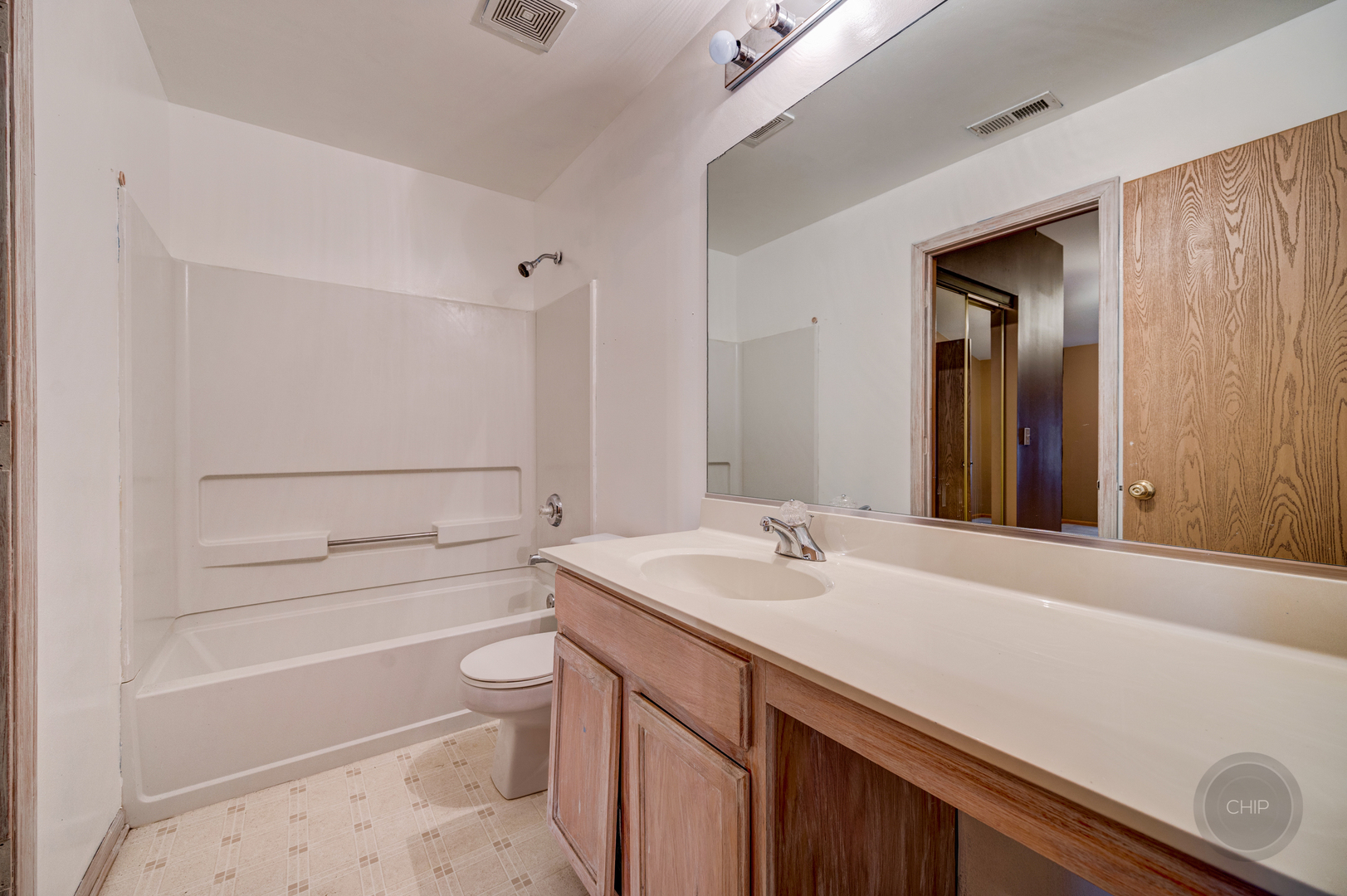 752 County Line Road Aurora, IL 60502 - Photo 22 of 30 a bathroom with a sink a toilet and shower