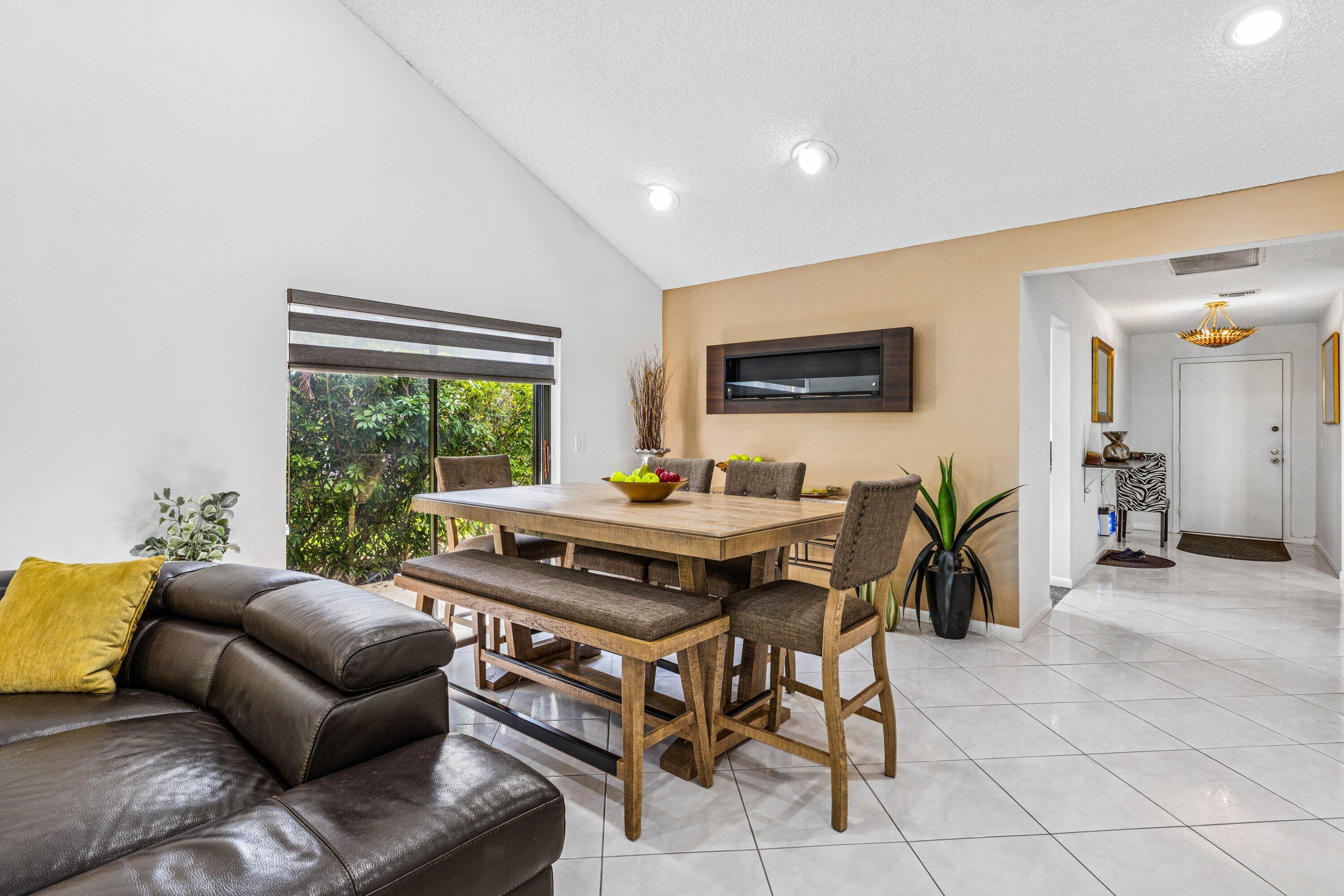 21720 Arriba Real, Unit 37B Boca Raton, FL 33433 - Photo 17 of 41 a living room with furniture and a flat screen tv