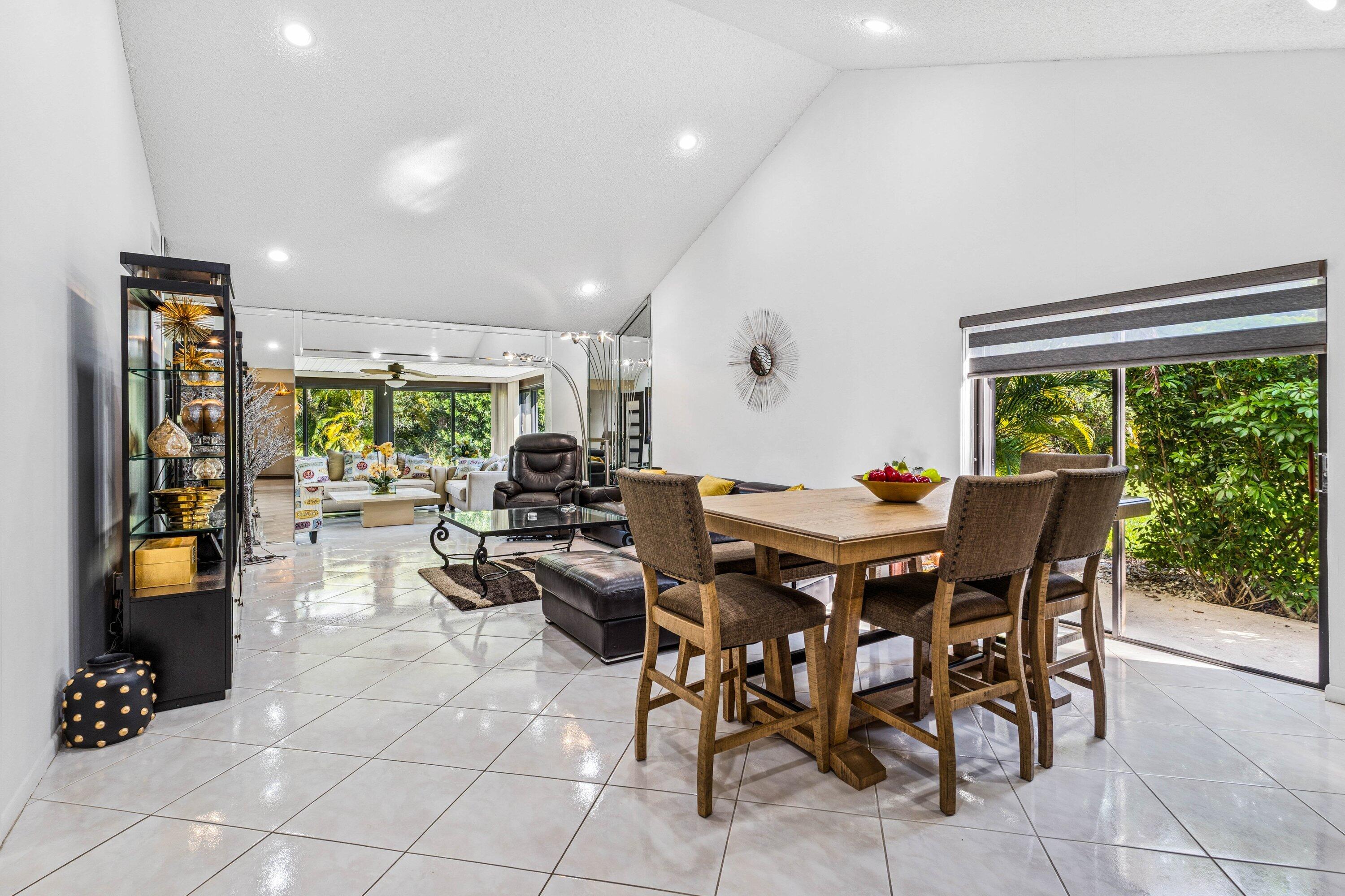 21720 Arriba Real, Unit 37B Boca Raton, FL 33433 - Photo 18 of 41 a view of a dining room with furniture and a potted plant