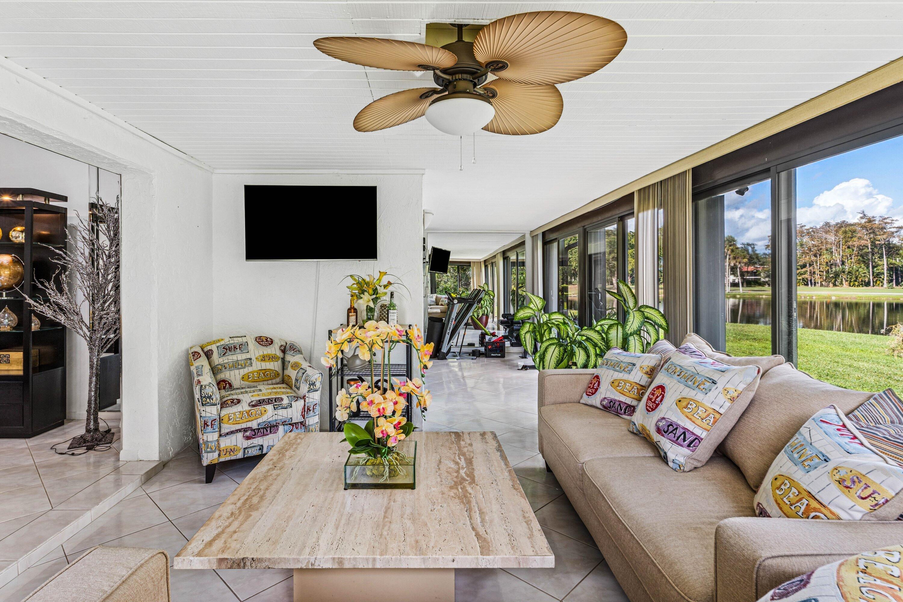 21720 Arriba Real, Unit 37B Boca Raton, FL 33433 - Photo 26 of 41 a living room with furniture and a flat screen tv
