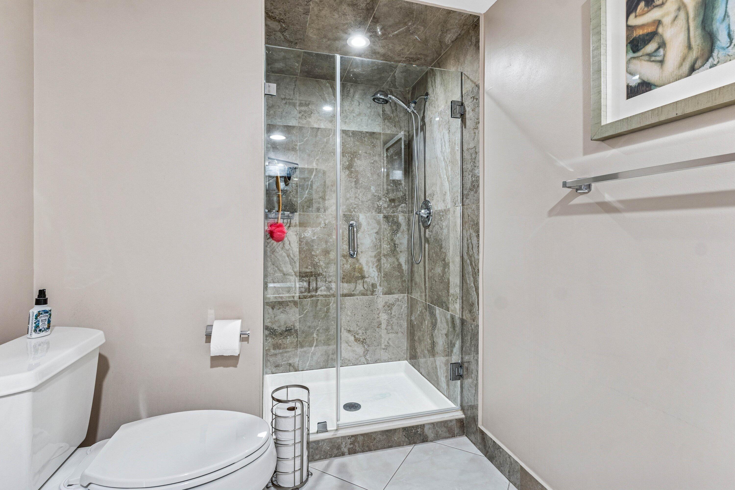 21720 Arriba Real, Unit 37B Boca Raton, FL 33433 - Photo 32 of 41 a bathroom with a toilet and shower