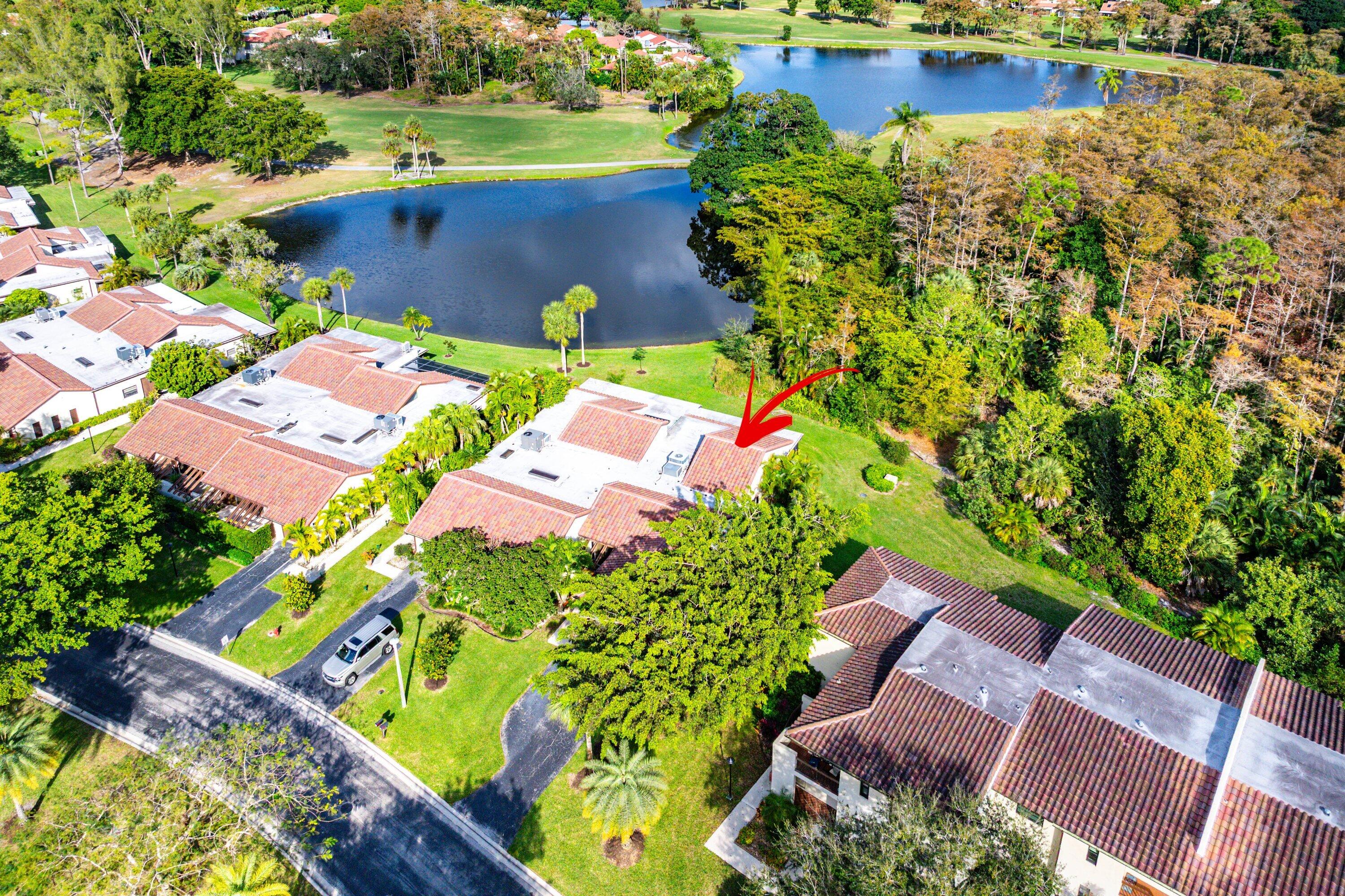 21720 Arriba Real, Unit 37B Boca Raton, FL 33433 - Photo 40 of 41 an aerial view of a house with a lake view