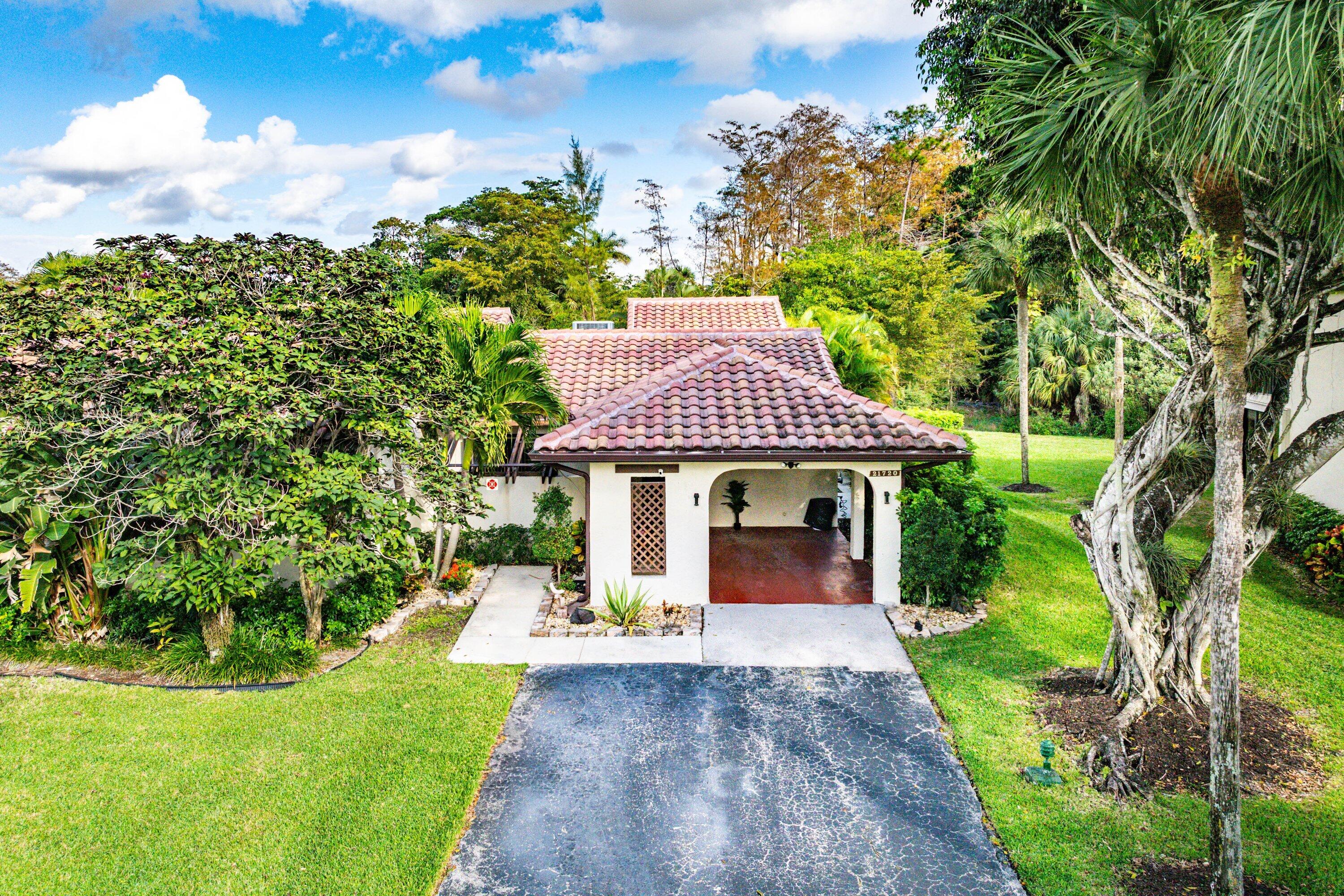 21720 Arriba Real, Unit 37B Boca Raton, FL 33433 - Photo 4 of 41 a view of a house with a yard