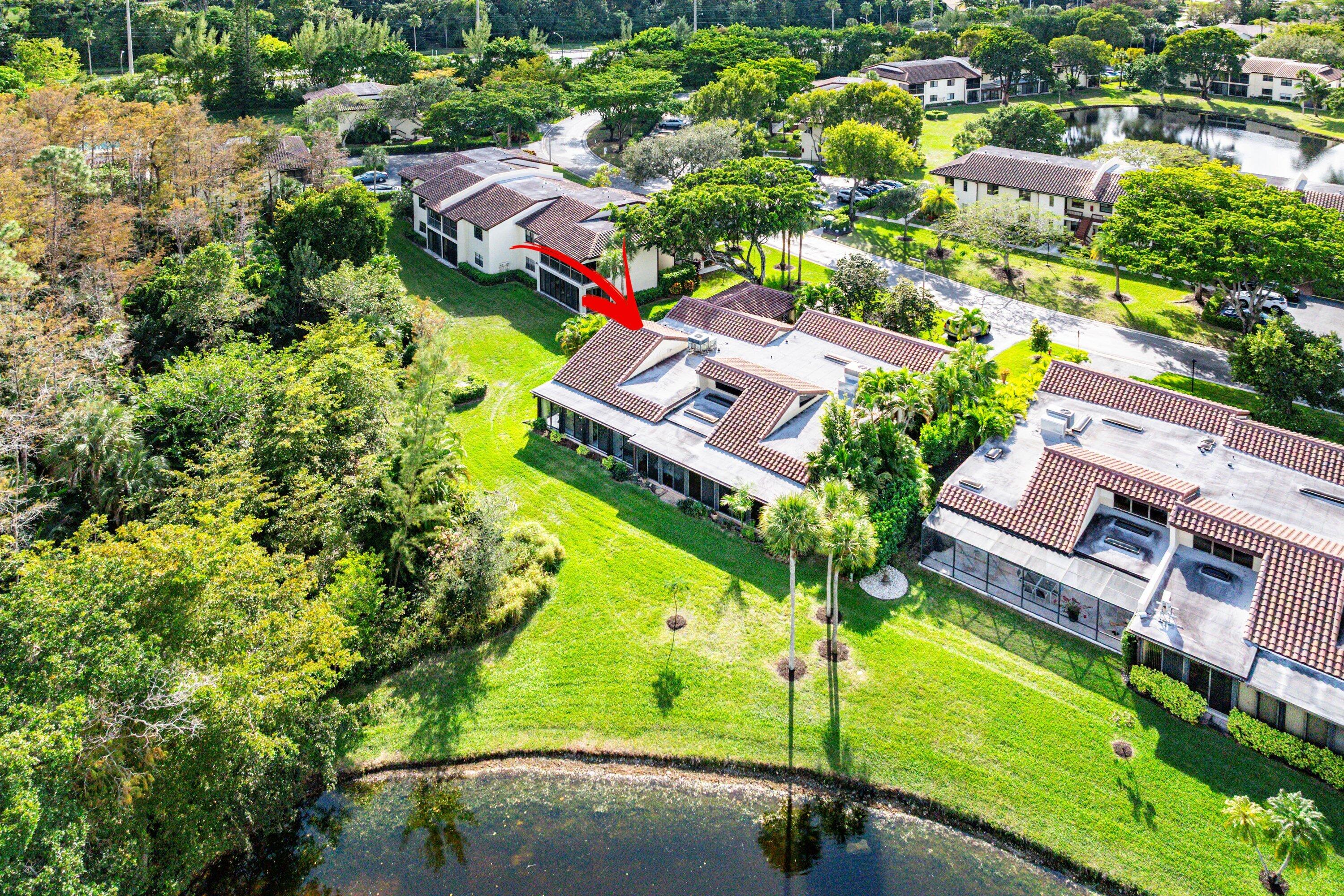 21720 Arriba Real, Unit 37B Boca Raton, FL 33433 - Photo 8 of 41 an aerial view of a house with a garden and swimming pool