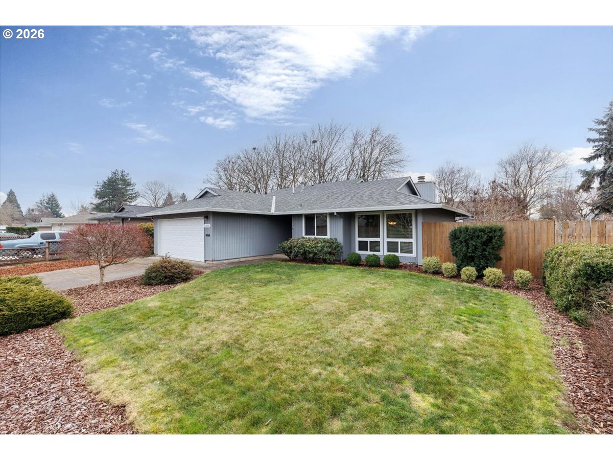 12790 Southwest Cleveland Bay Lane Beaverton, OR 97008 - Photo 2 of 32 a view of a house with a backyard and a tree