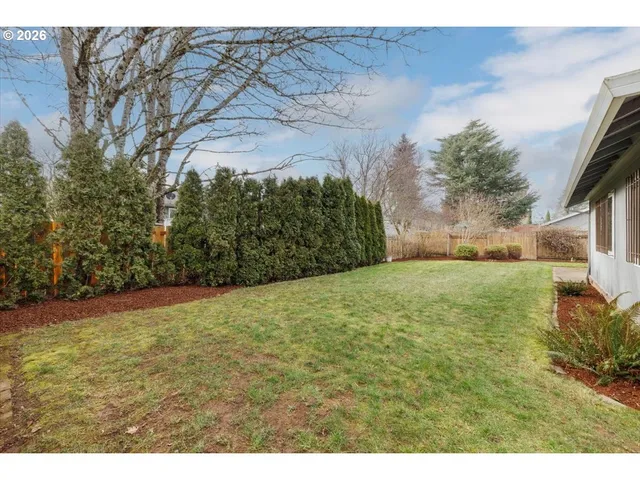 a view of a backyard of the house