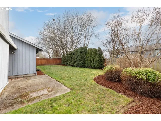 a backyard of a house with lots of green space
