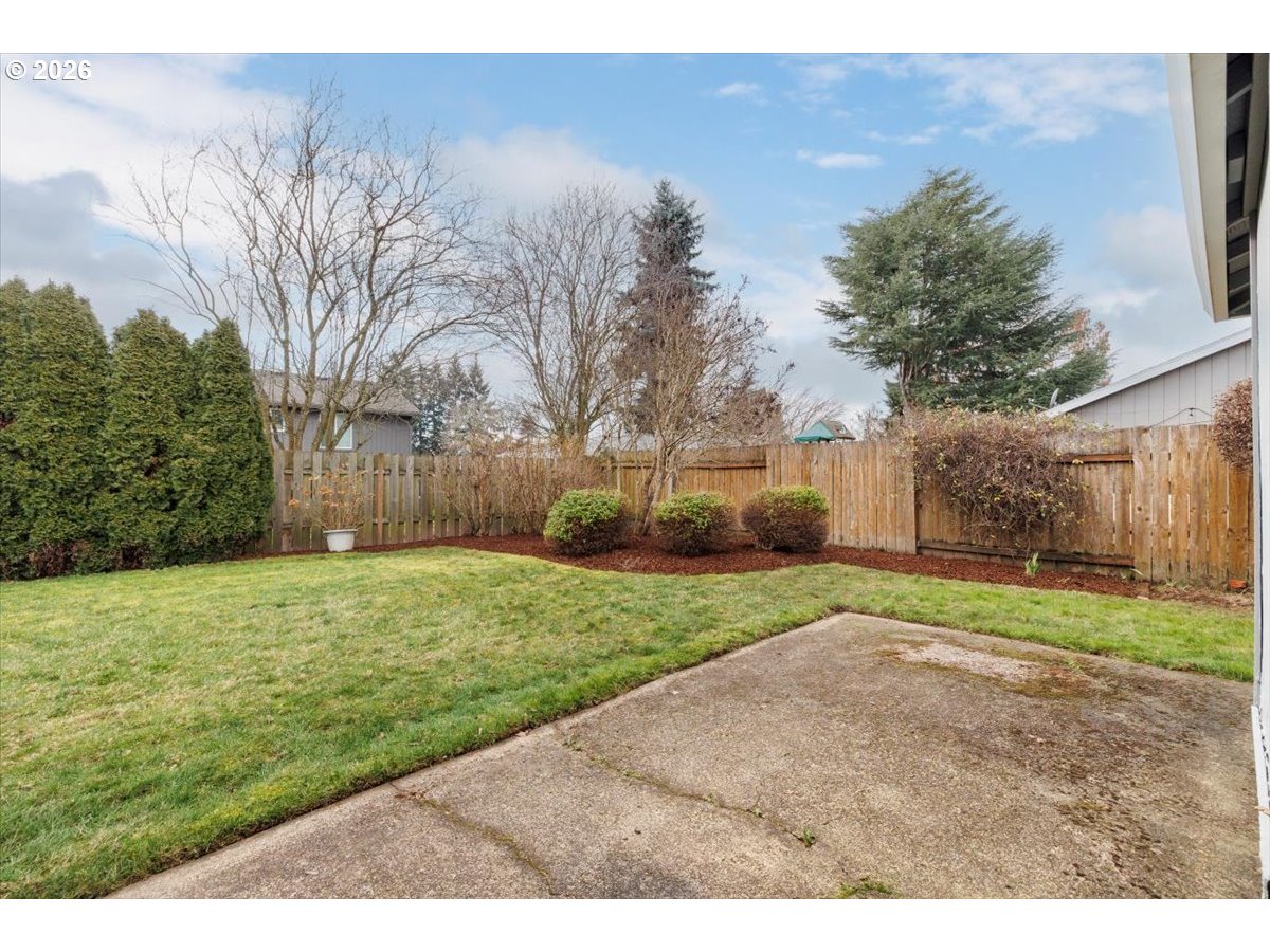 12790 Southwest Cleveland Bay Lane Beaverton, OR 97008 - Photo 29 of 32 a backyard of a house with lots of green space