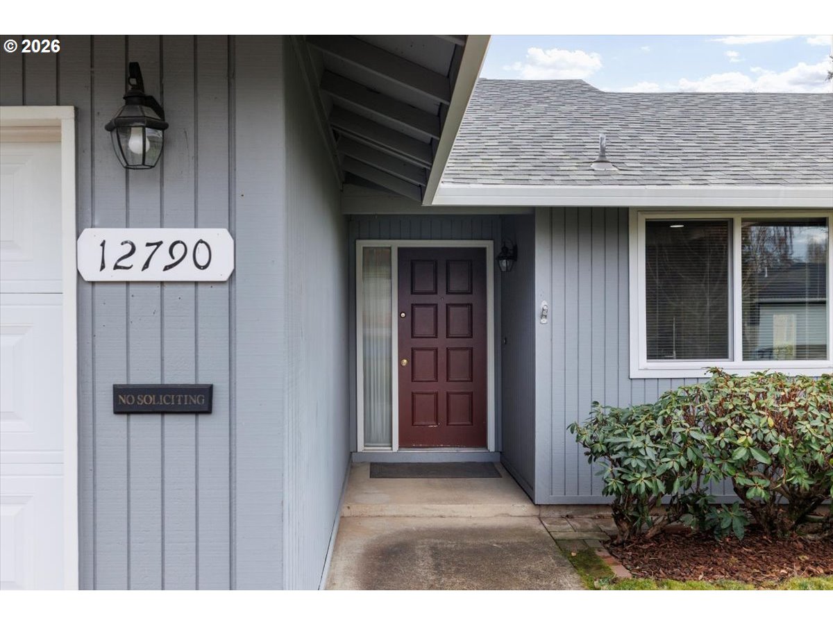 12790 Southwest Cleveland Bay Lane Beaverton, OR 97008 - Photo 4 of 32 a view of a entryway door of the house