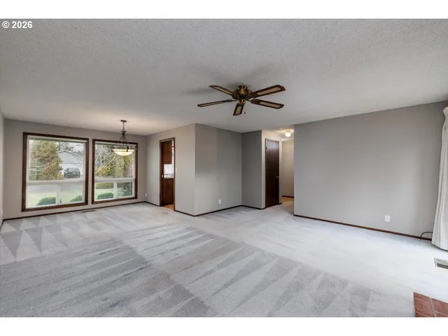 a view of a room with window wooden floor