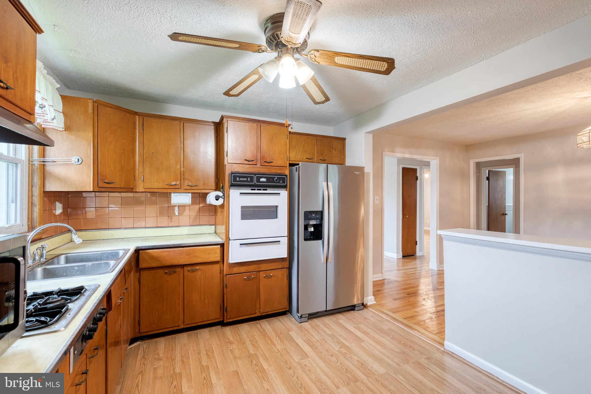 8306 Berkfield Road Baltimore, MD 21237 - Photo 15 of 29 Charming kitchen with warm wood tones.