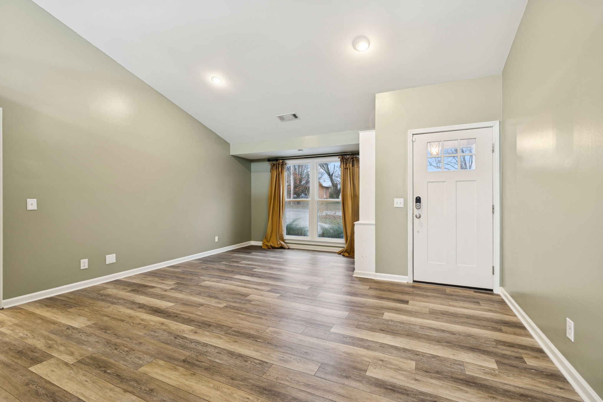 350 State Street Cookeville, TN 38501 - Photo 13 of 44 a view of an empty room with wooden floor and a window