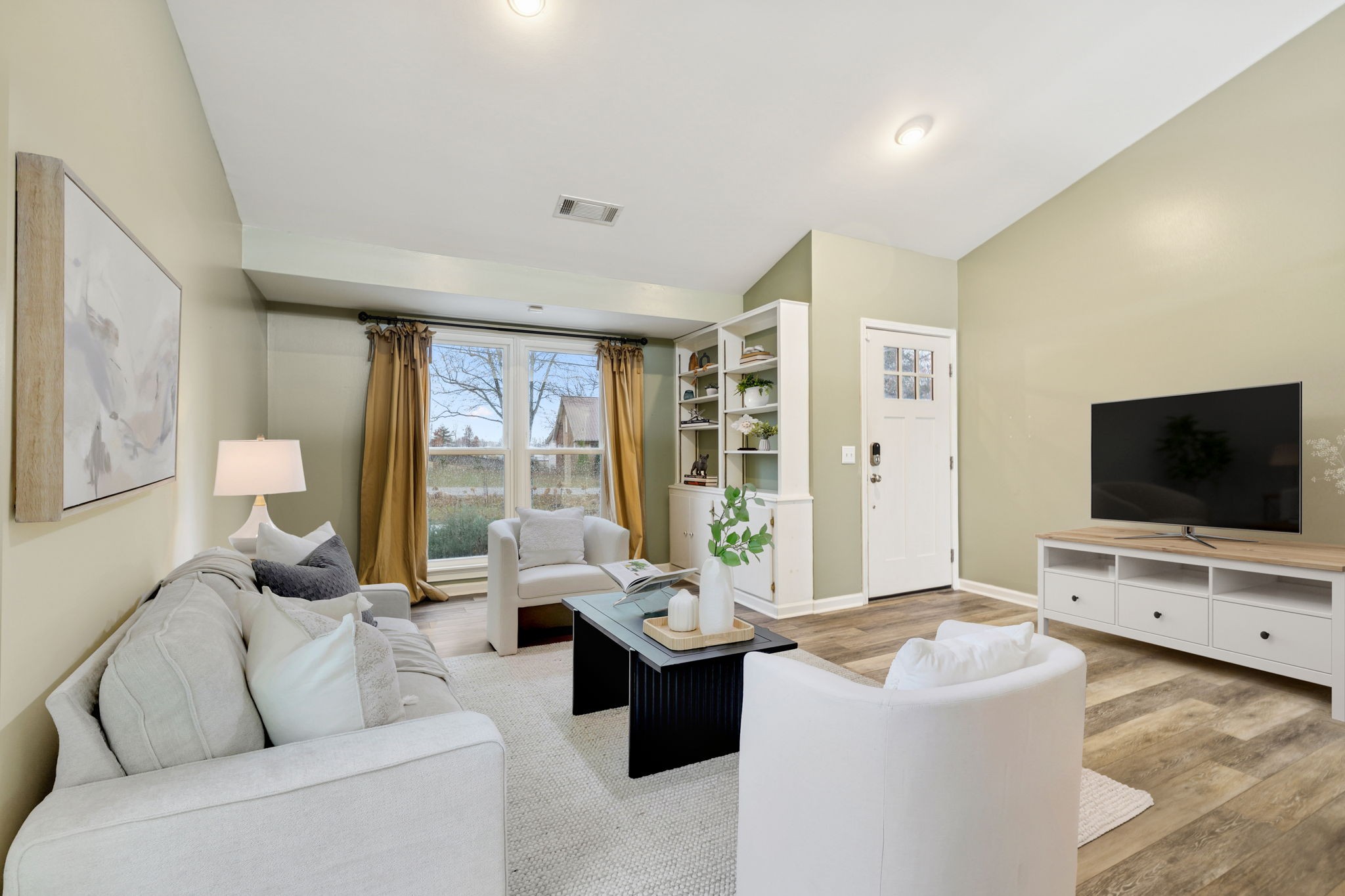 350 State Street Cookeville, TN 38501 - Photo 14 of 44 a living room with furniture a flat screen tv and a floor to ceiling window