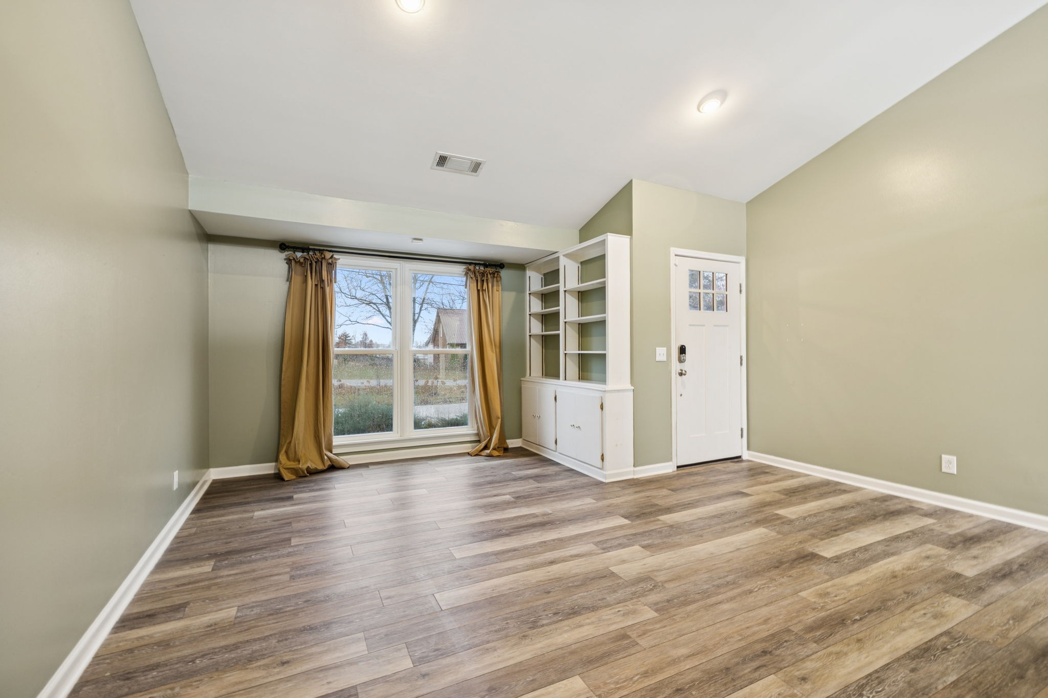 350 State Street Cookeville, TN 38501 - Photo 15 of 44 a view of an empty room with wooden floor