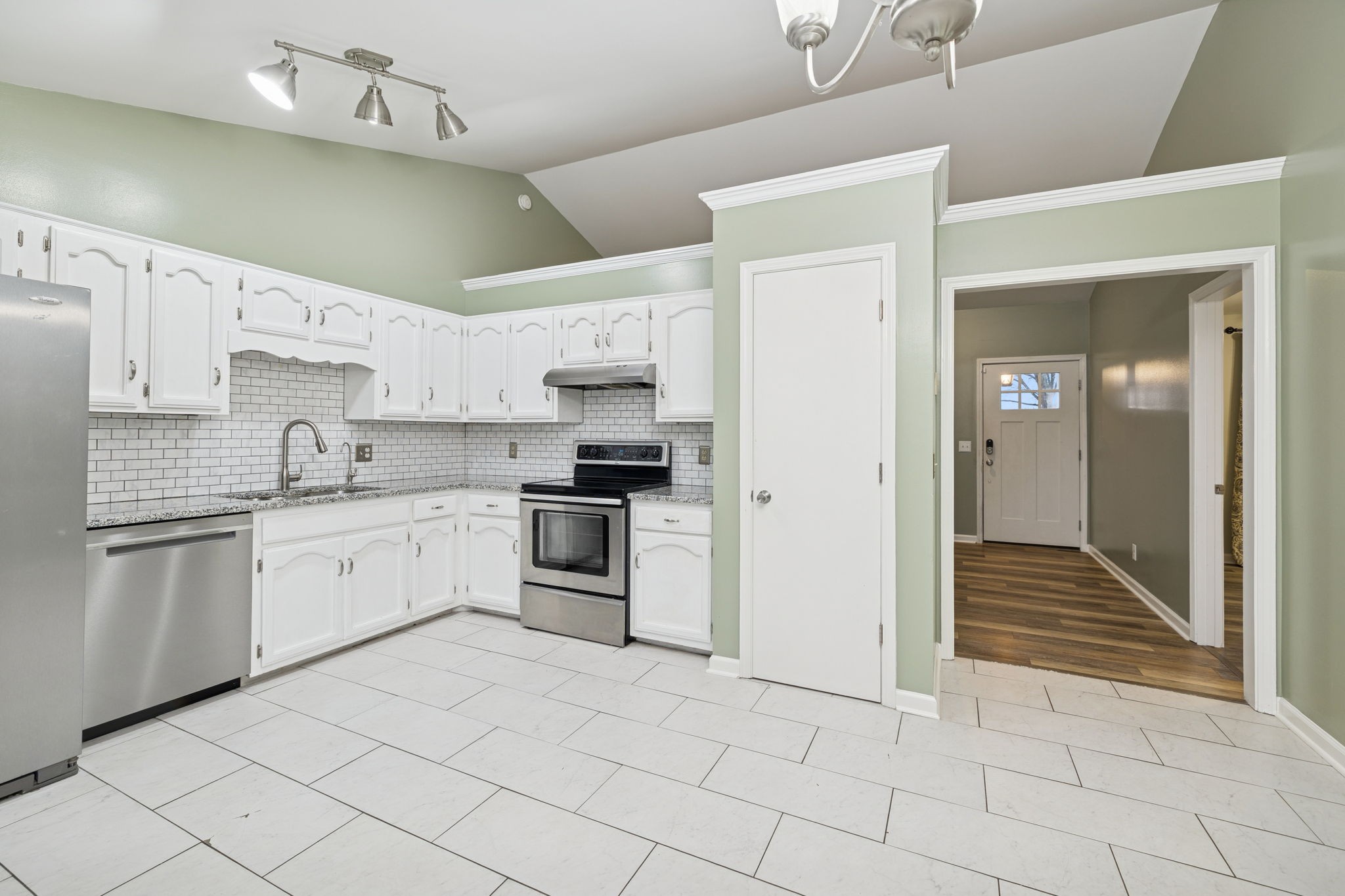 350 State Street Cookeville, TN 38501 - Photo 18 of 44 a kitchen with white cabinets and appliances