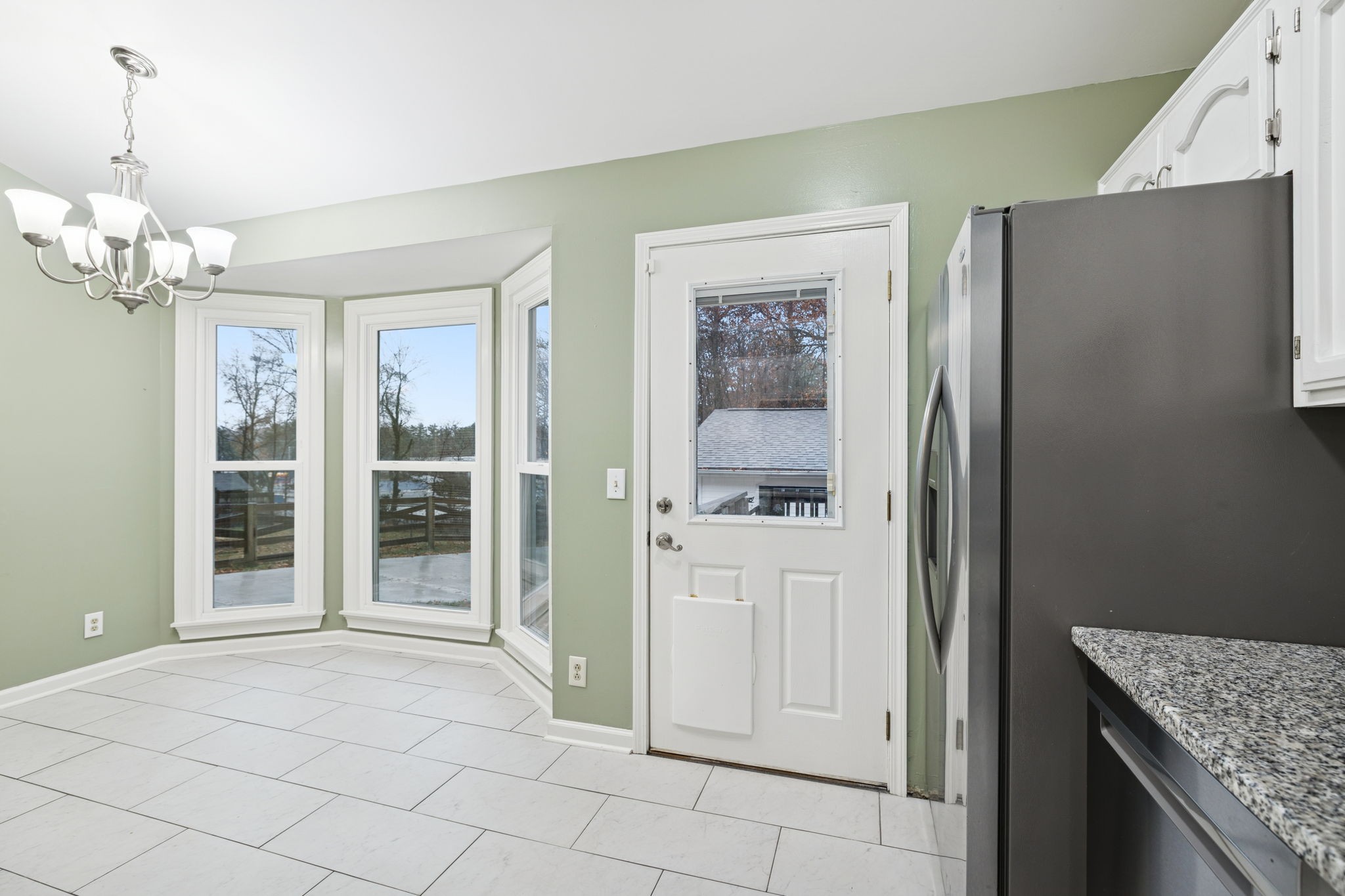 350 State Street Cookeville, TN 38501 - Photo 20 of 44 a spacious bathroom with a granite countertop sink and a mirror