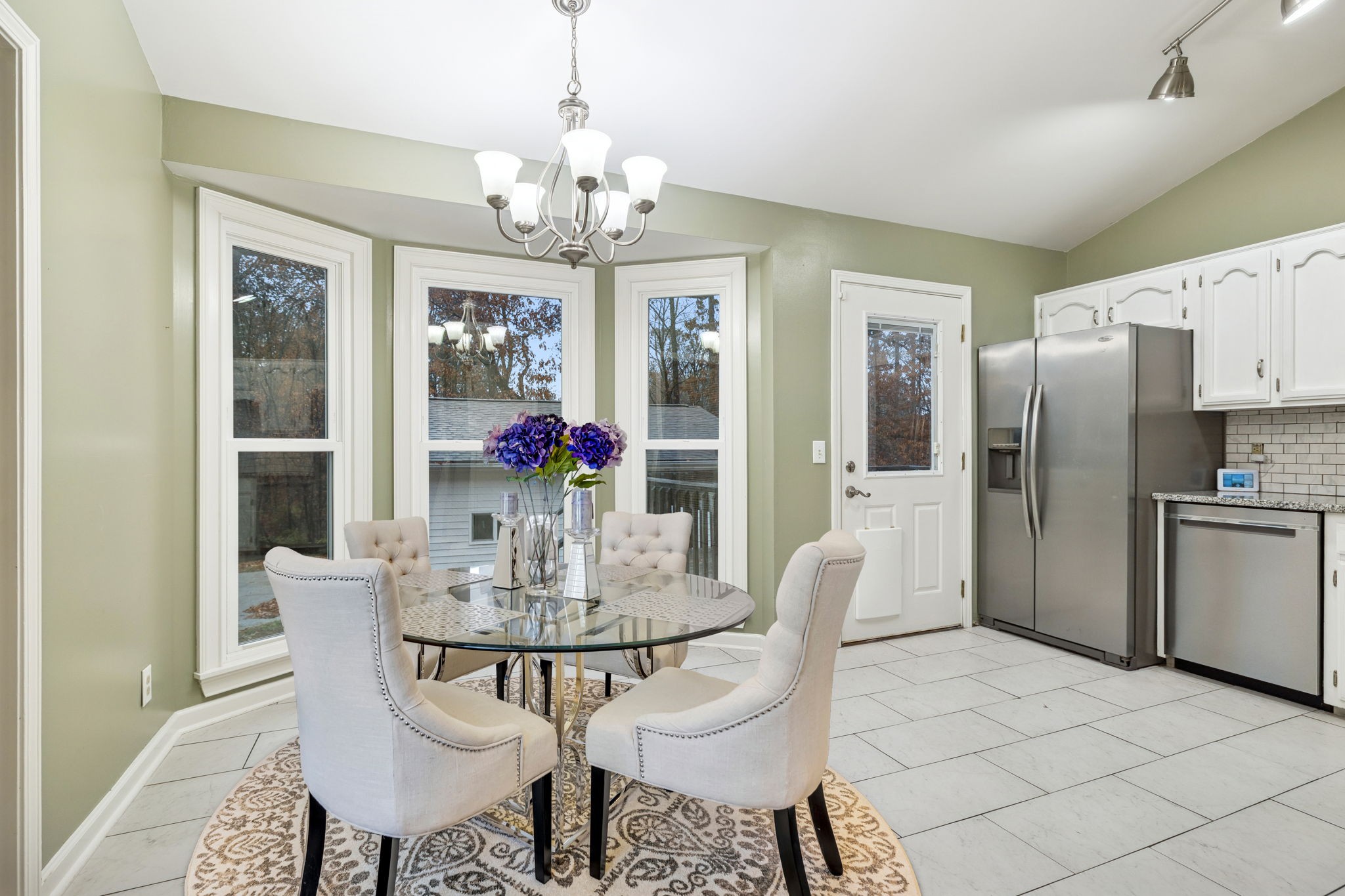 350 State Street Cookeville, TN 38501 - Photo 22 of 44 a view of a dining room with furniture a chandelier and wooden floor