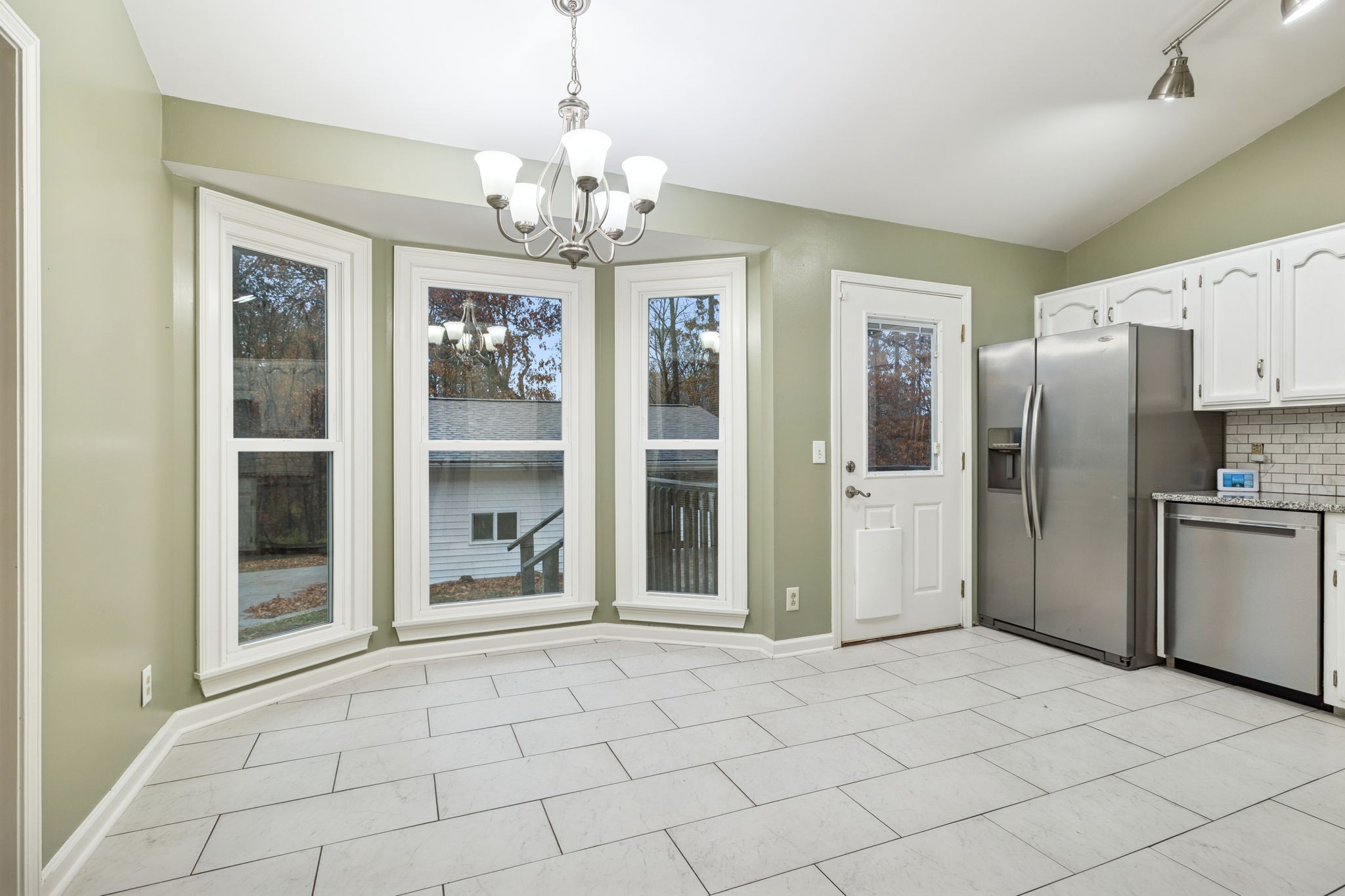 350 State Street Cookeville, TN 38501 - Photo 23 of 44 a view of a kitchen with a sink and refrigerator cabinets