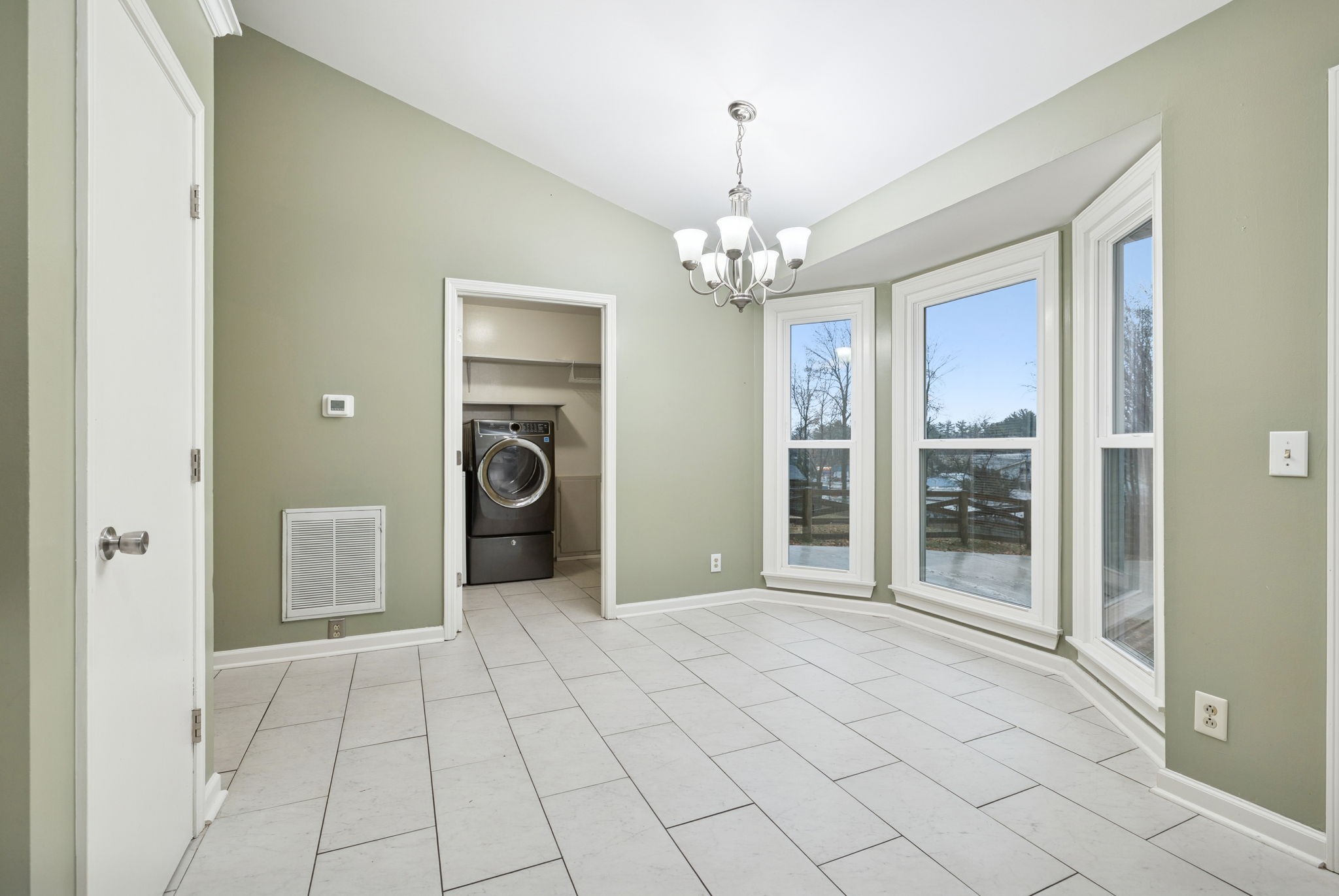 350 State Street Cookeville, TN 38501 - Photo 24 of 44 a view of a livingroom with a chandelier and glass door