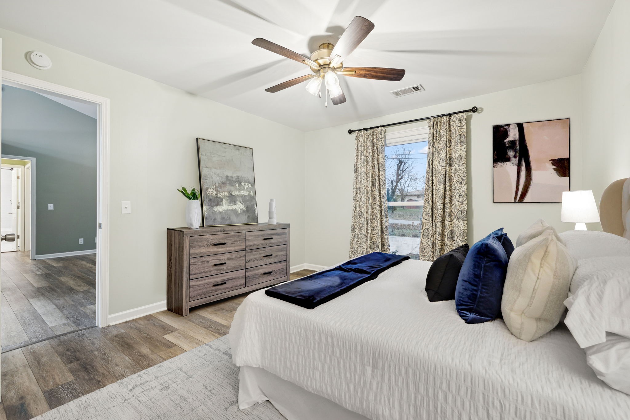 350 State Street Cookeville, TN 38501 - Photo 26 of 44 a bedroom with a bed and a chandelier