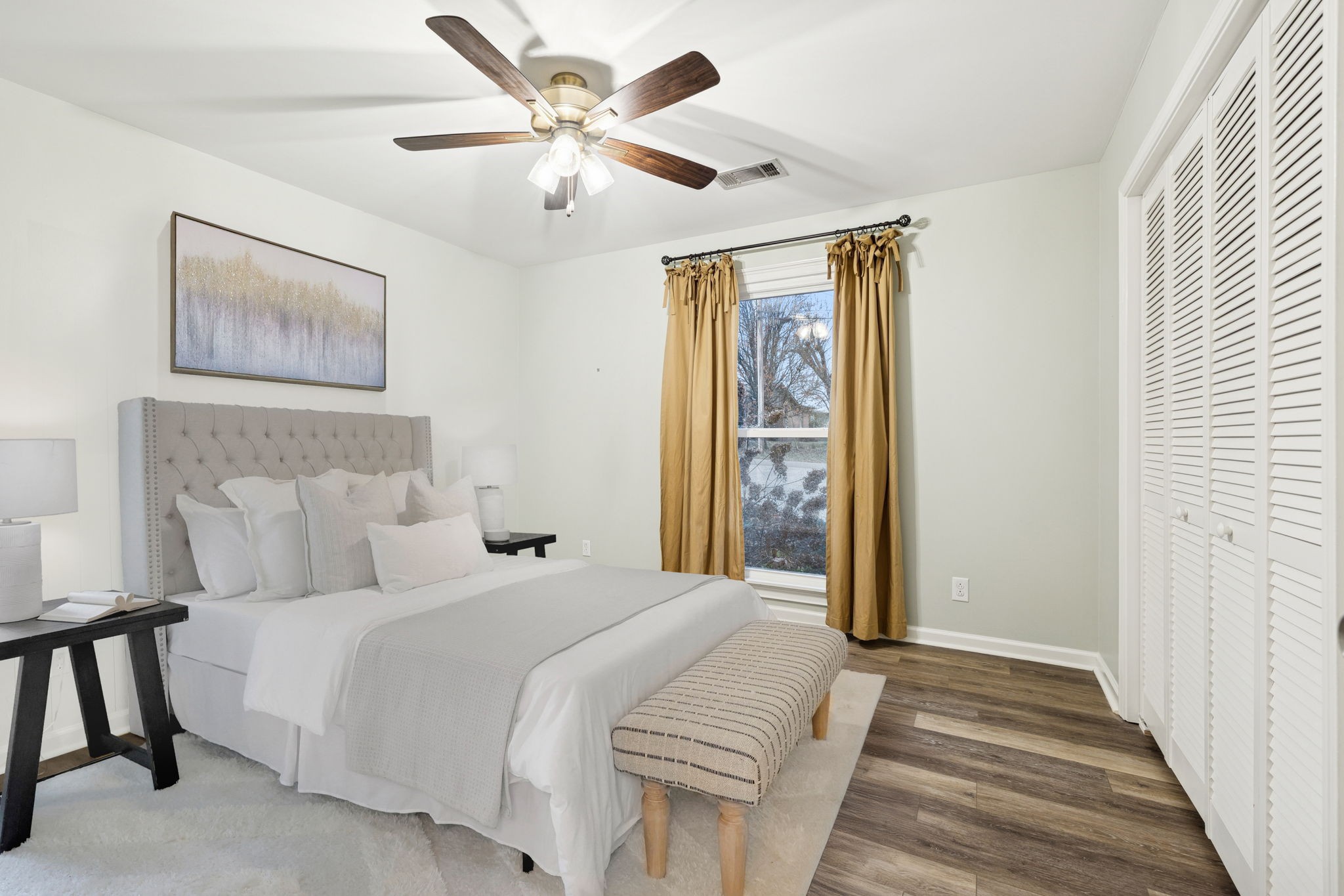 350 State Street Cookeville, TN 38501 - Photo 30 of 44 a bedroom with a large bed and a chandelier