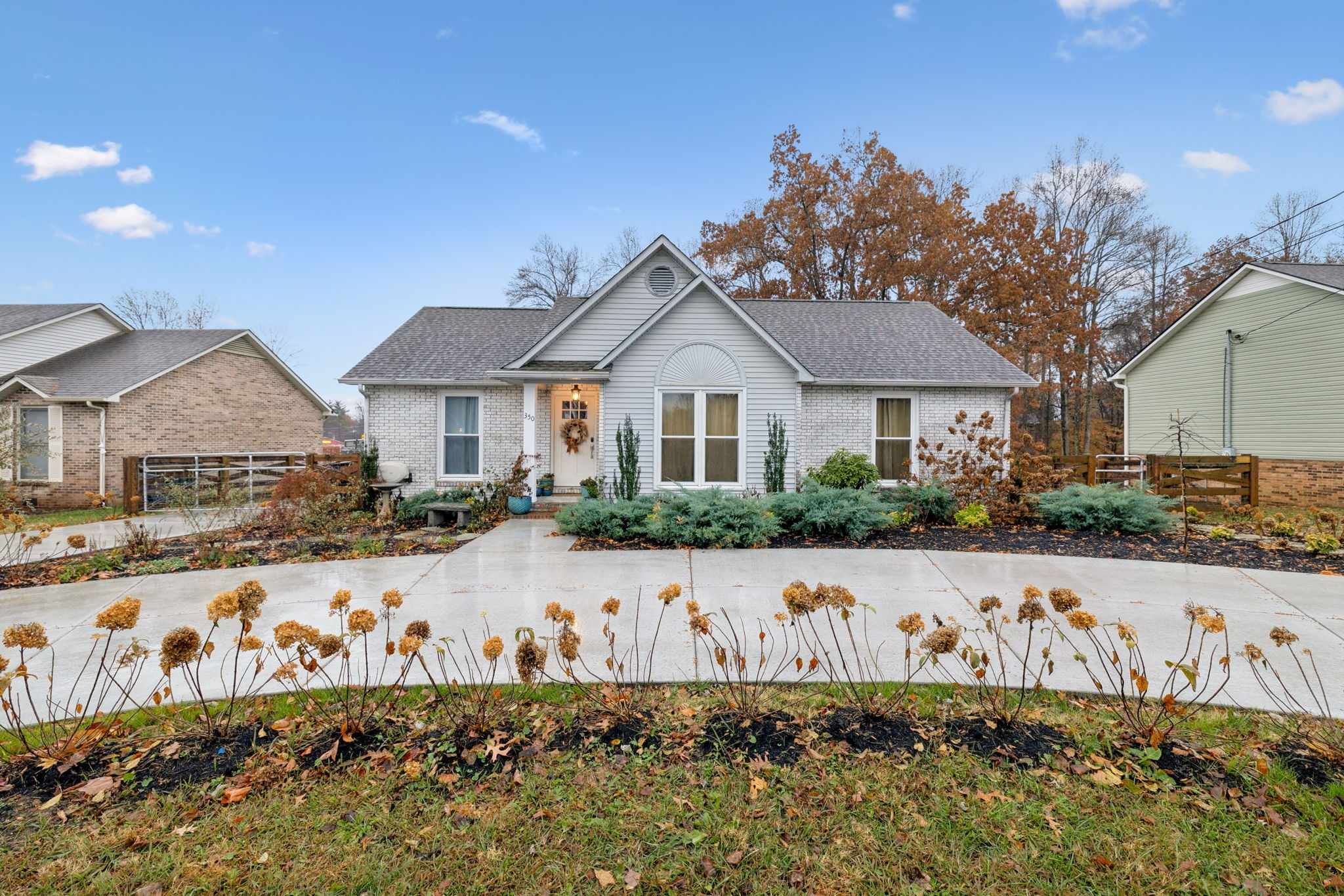 350 State Street Cookeville, TN 38501 - Photo 5 of 44 a front view of a house with a yard and garage