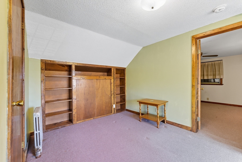 60 Barrison Street Springfield, MA 01109 - Photo 17 of 25 a room with a closet and wooden floor