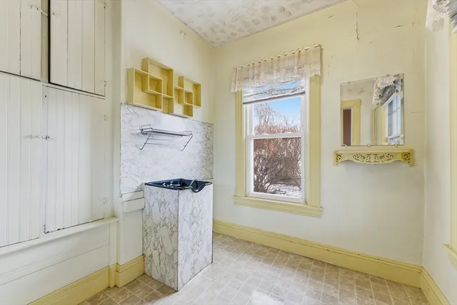 a view of a door and chair in the room