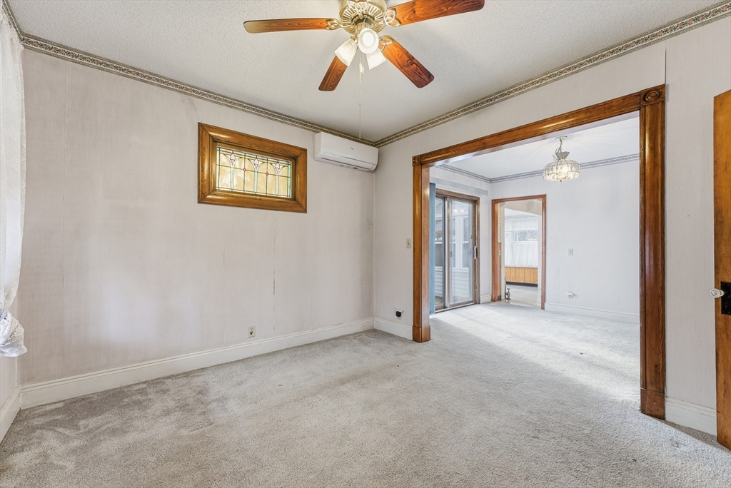 60 Barrison Street Springfield, MA 01109 - Photo 5 of 25 an empty room with windows and fan
